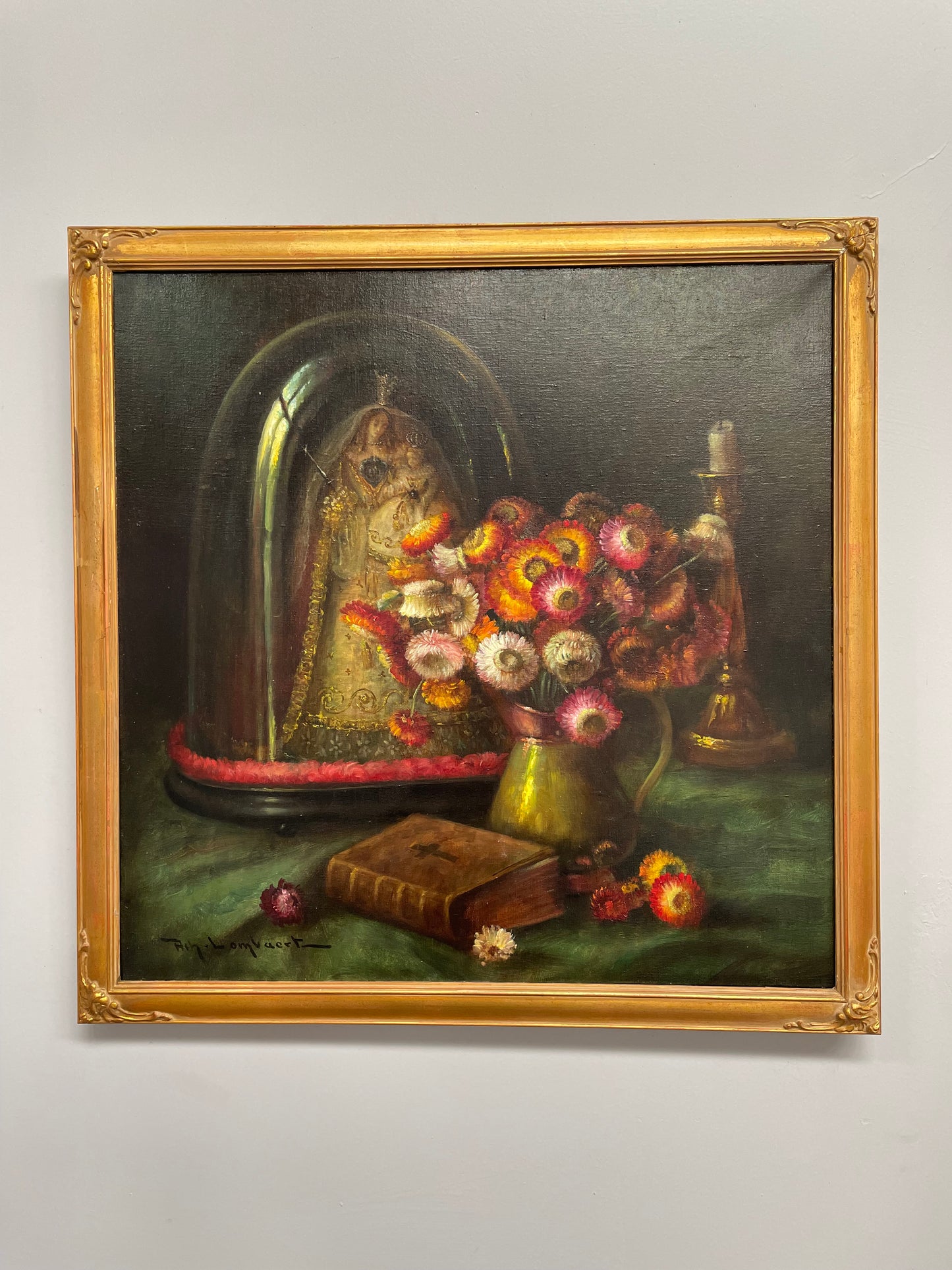Beautiful French canvas painting of flowers and a bible framed in a lovely gold frame. It is in good original condition.