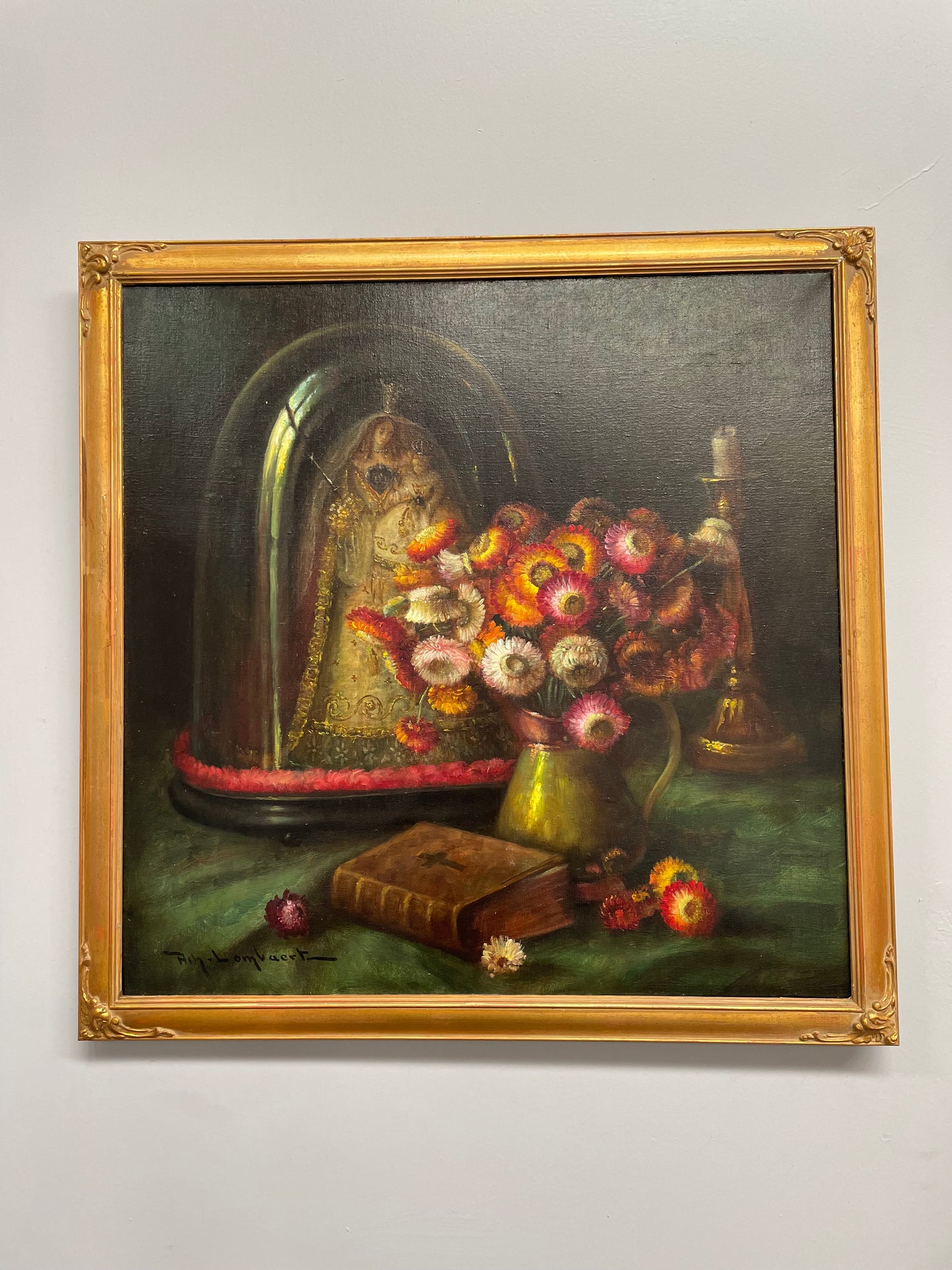 Beautiful French canvas painting of flowers and a bible framed in a lovely gold frame. It is in good original condition.