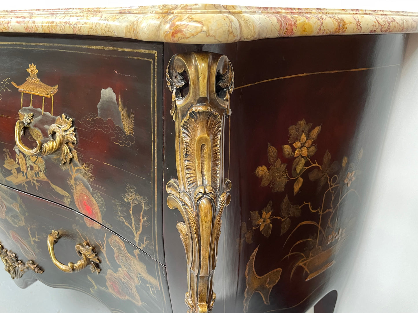 A stunning Antique Louis XV style Chinoiseries marble top two drawer commode with beautiful hand painted decorative details throughout. It has quality decorative ormolu mounts and handles. It is in good original detailed condition.