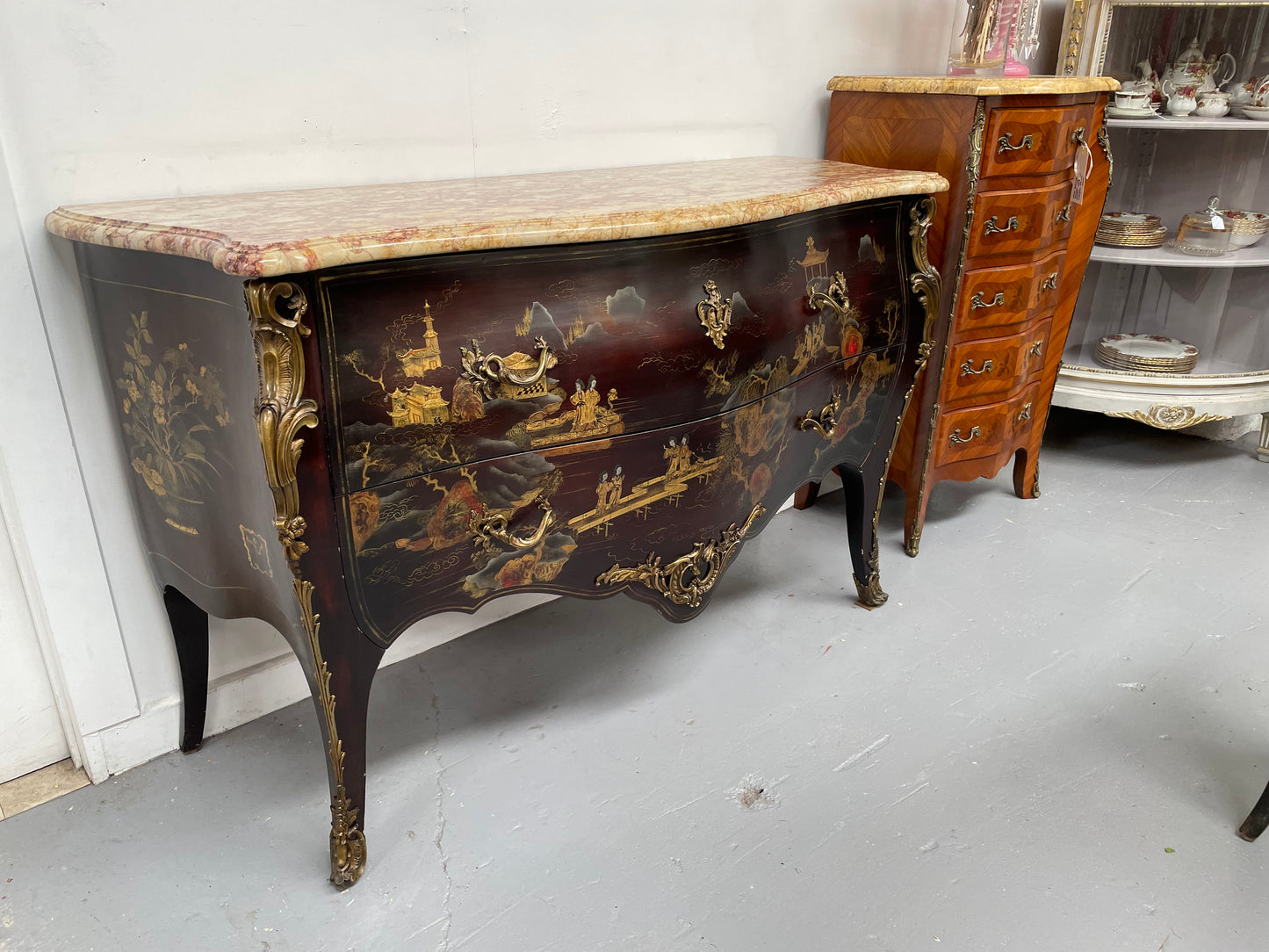 A stunning Antique Louis XV style Chinoiseries marble top two drawer commode with beautiful hand painted decorative details throughout. It has quality decorative ormolu mounts and handles. It is in good original detailed condition.