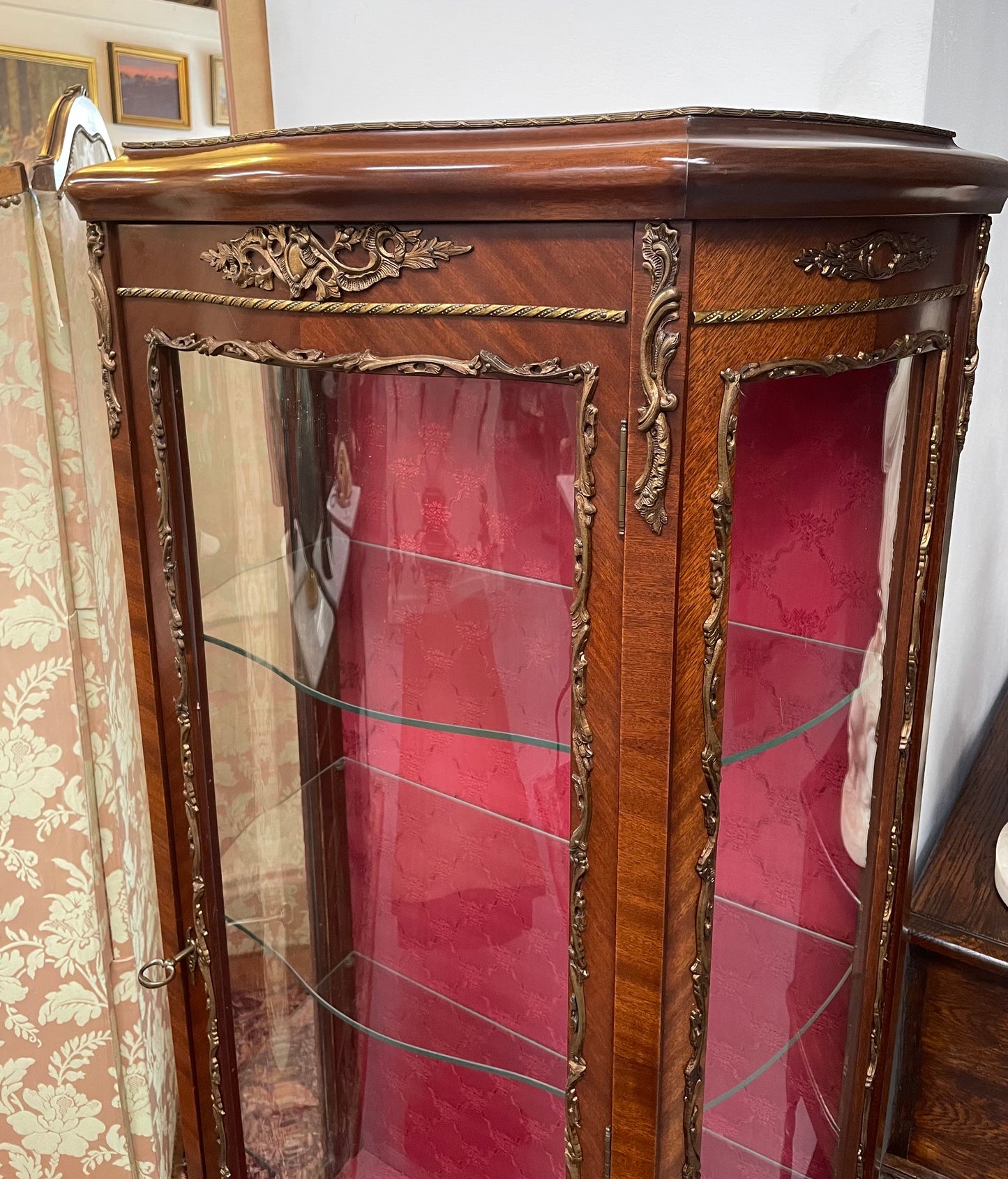 Beautiful French Louis XV style Walnut and bronze mounted vitrine with fabric interior and glass shelves. Sourced from France and in good original detailed condition.