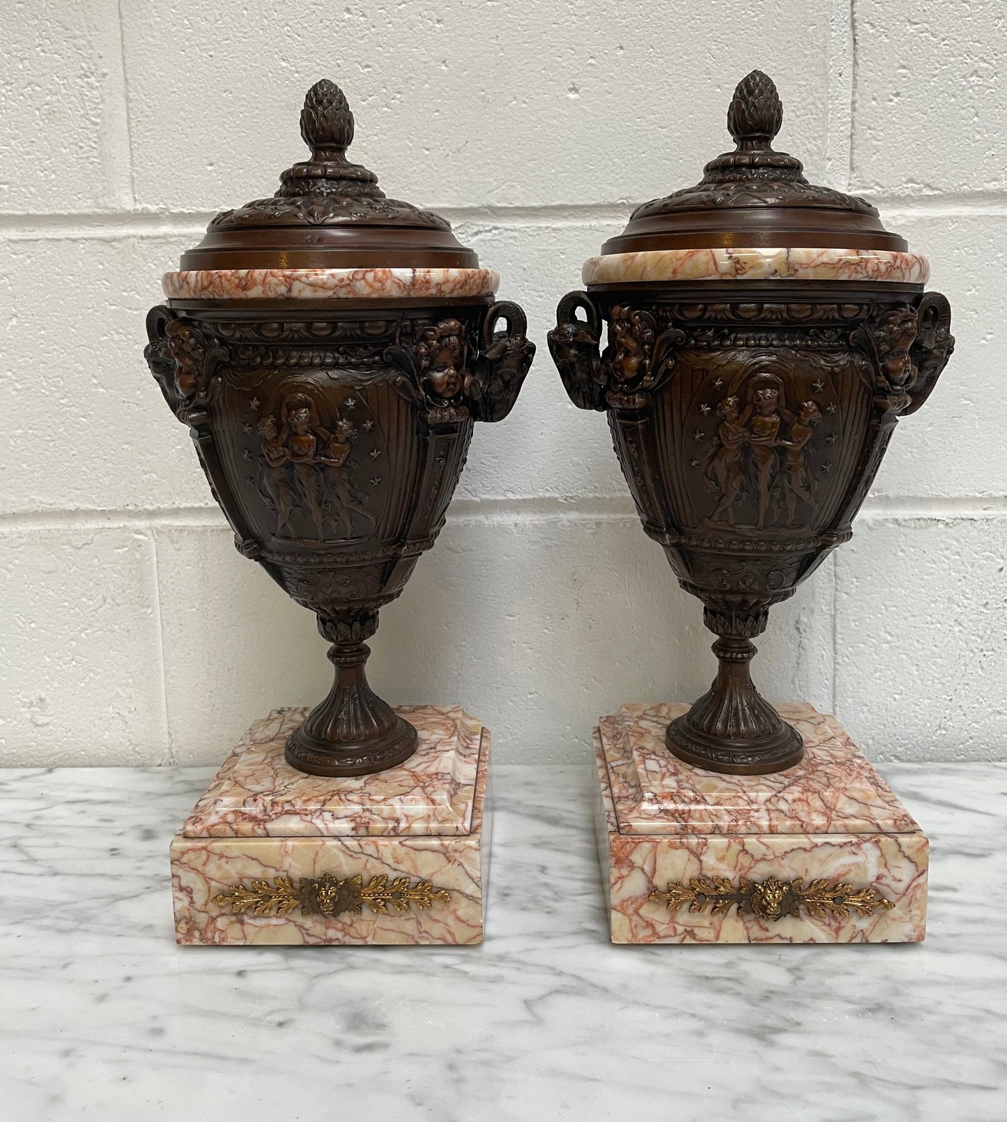 Pair of French Bronzed Spelter Urns on a Marble Base