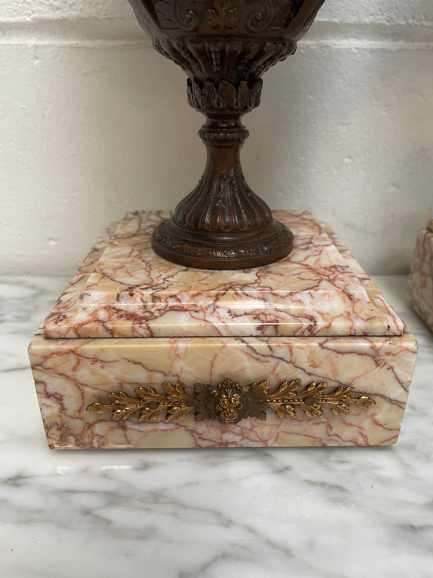 Pair of French Bronzed Spelter Urns on a Marble Base