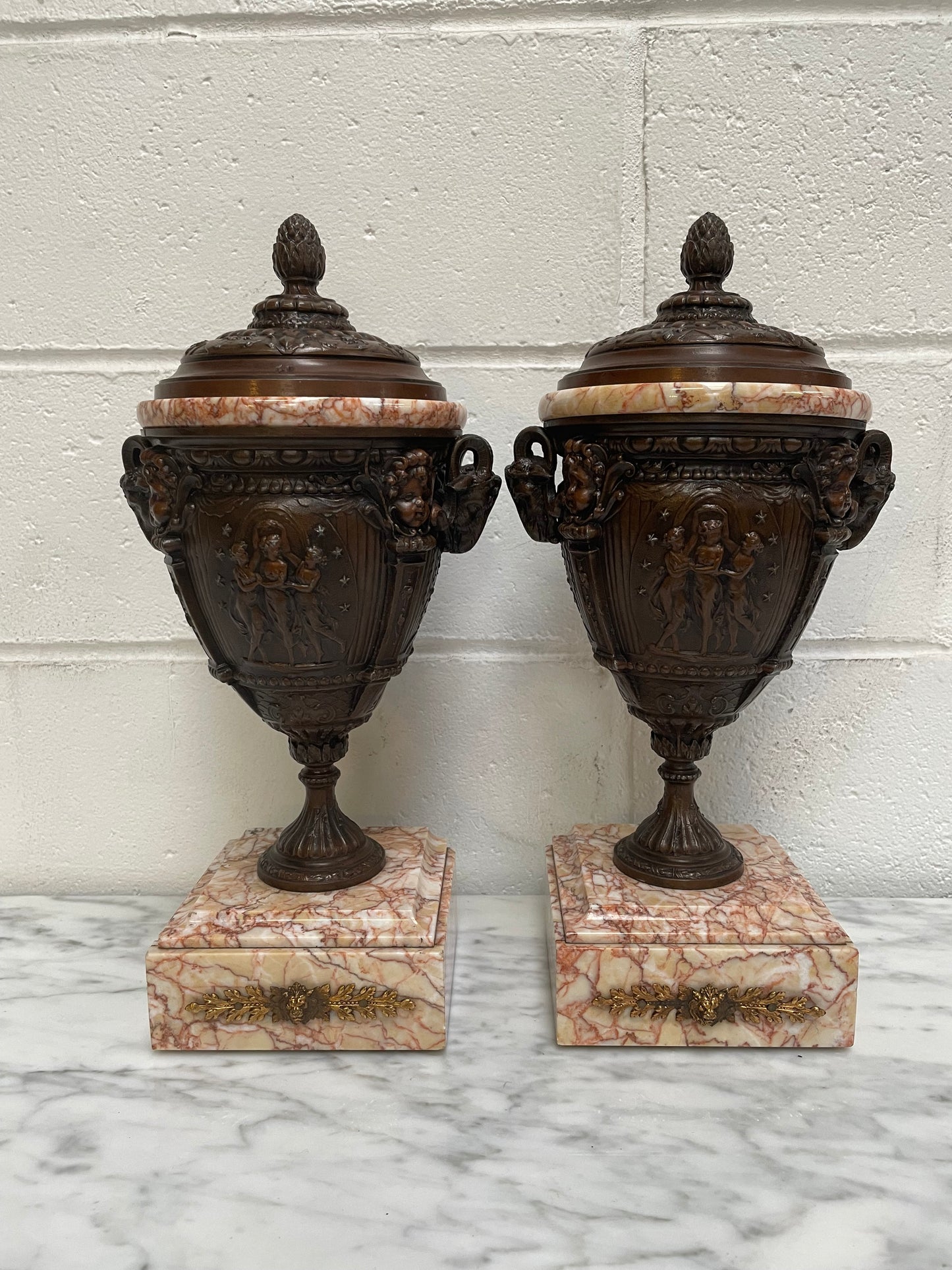 Pair of French Bronzed Spelter Urns on a Marble Base