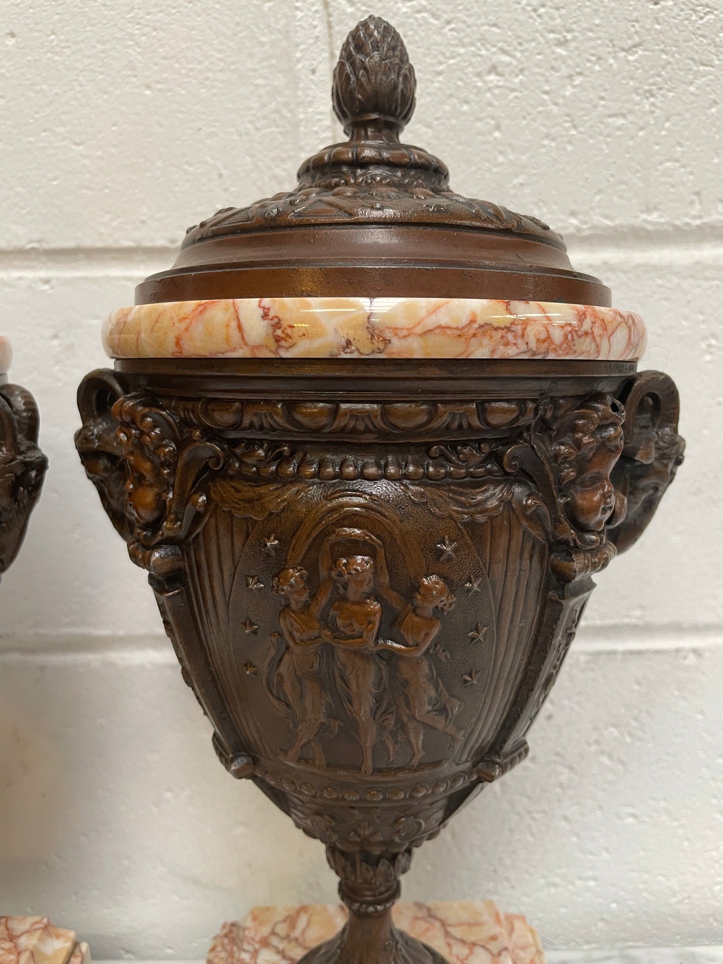 Pair of French Bronzed Spelter Urns on a Marble Base