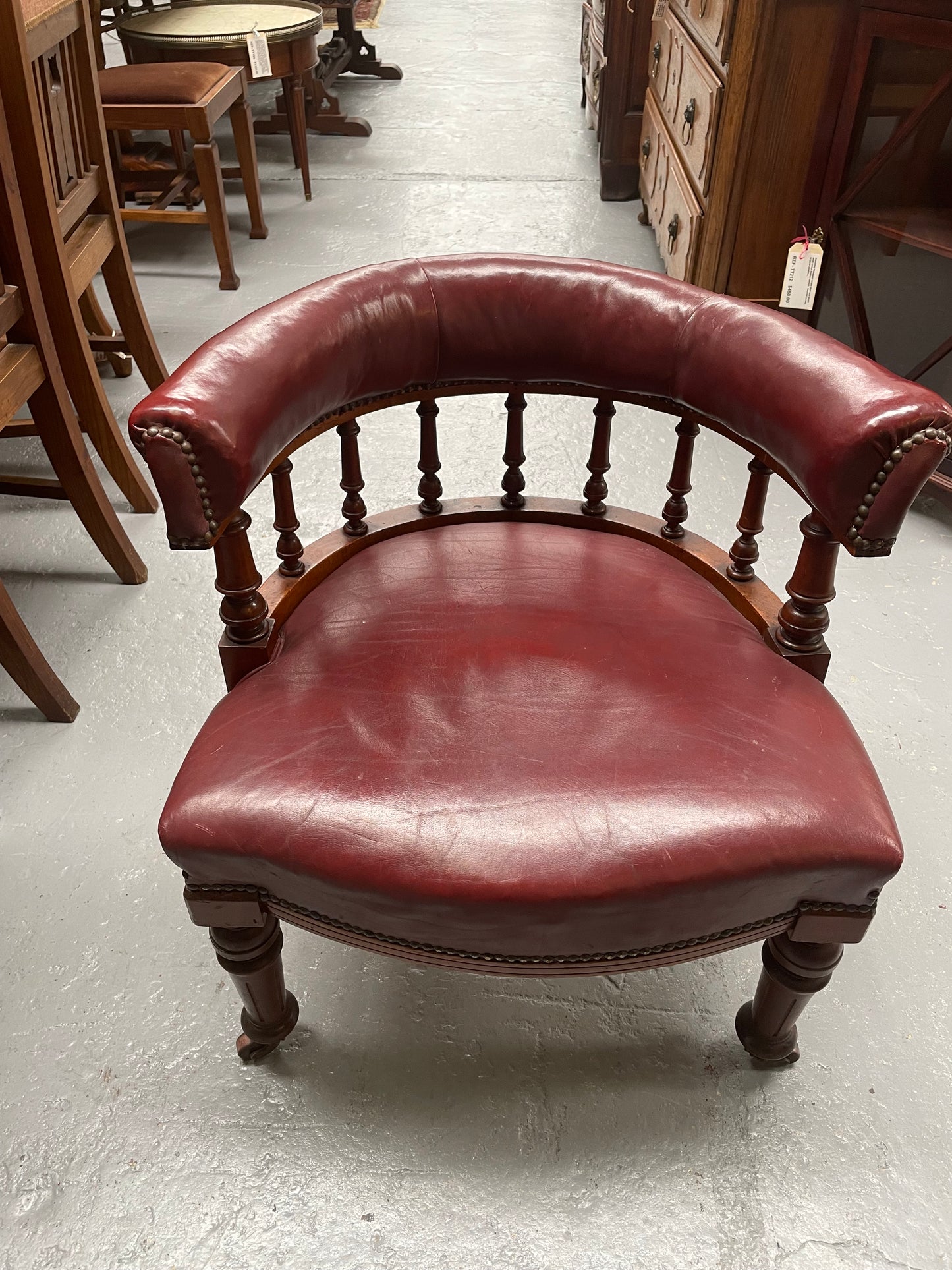 Fabulous late Victorian burgundy leather desk/tub chair on castor wheels. It is very comfortable to sit in and in good original condition.