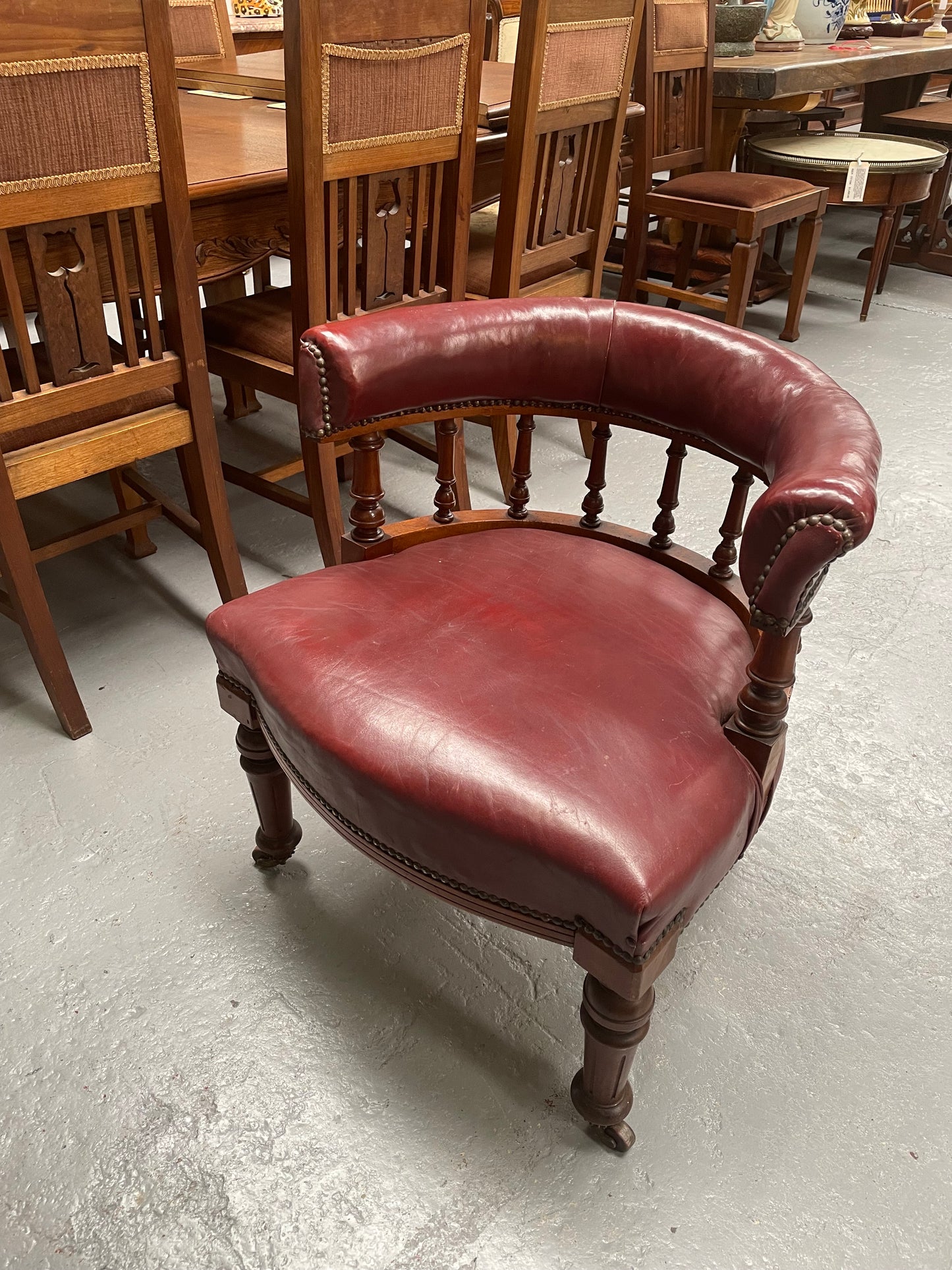 Fabulous late Victorian burgundy leather desk/tub chair on castor wheels. It is very comfortable to sit in and in good original condition.