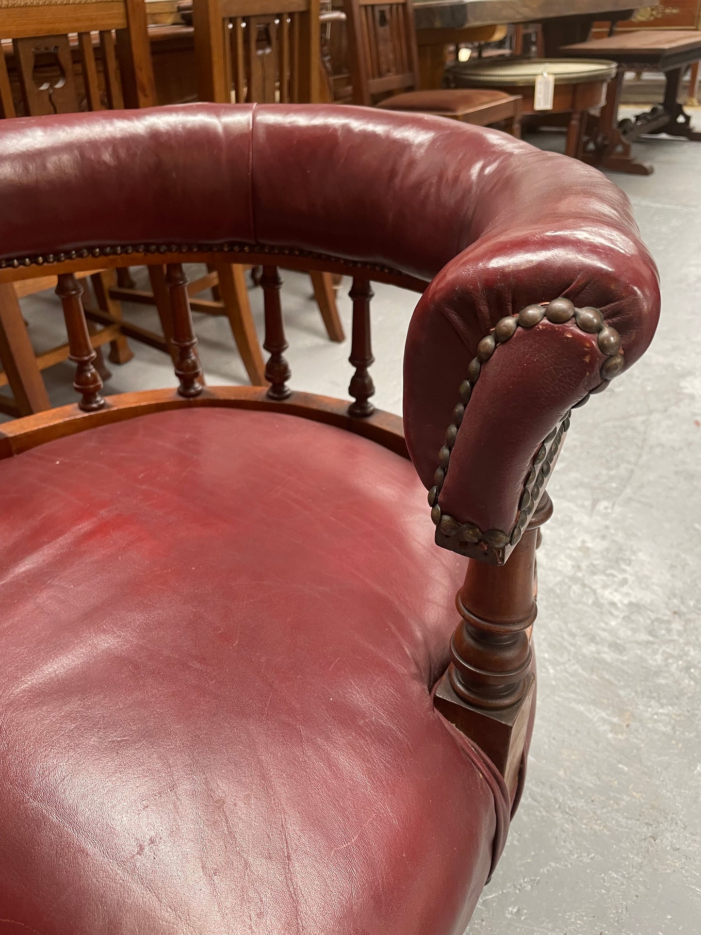 Fabulous late Victorian burgundy leather desk/tub chair on castor wheels. It is very comfortable to sit in and in good original condition.