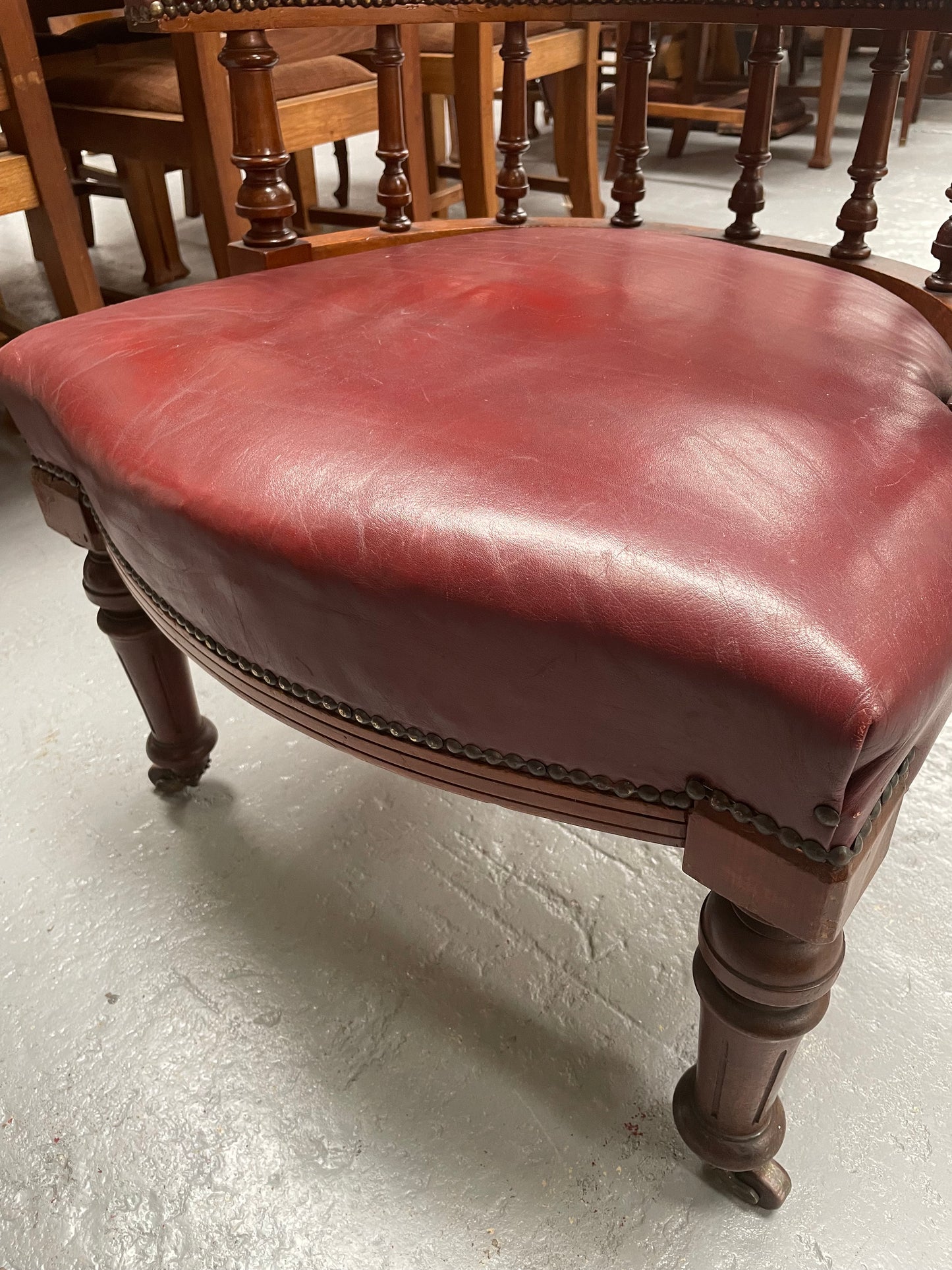 Fabulous late Victorian burgundy leather desk/tub chair on castor wheels. It is very comfortable to sit in and in good original condition.