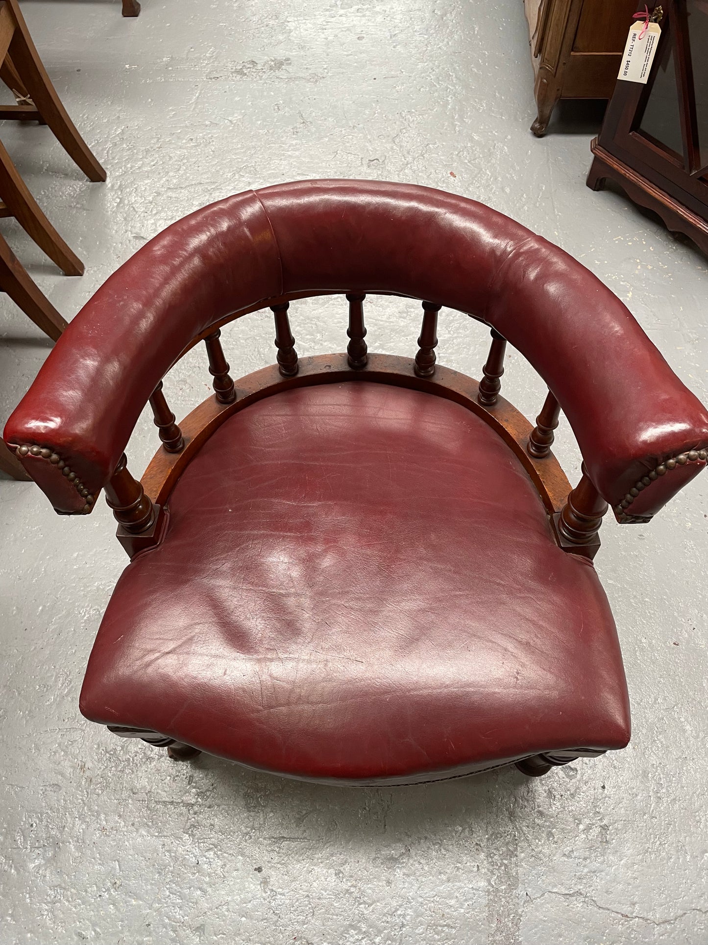 Fabulous late Victorian burgundy leather desk/tub chair on castor wheels. It is very comfortable to sit in and in good original condition.