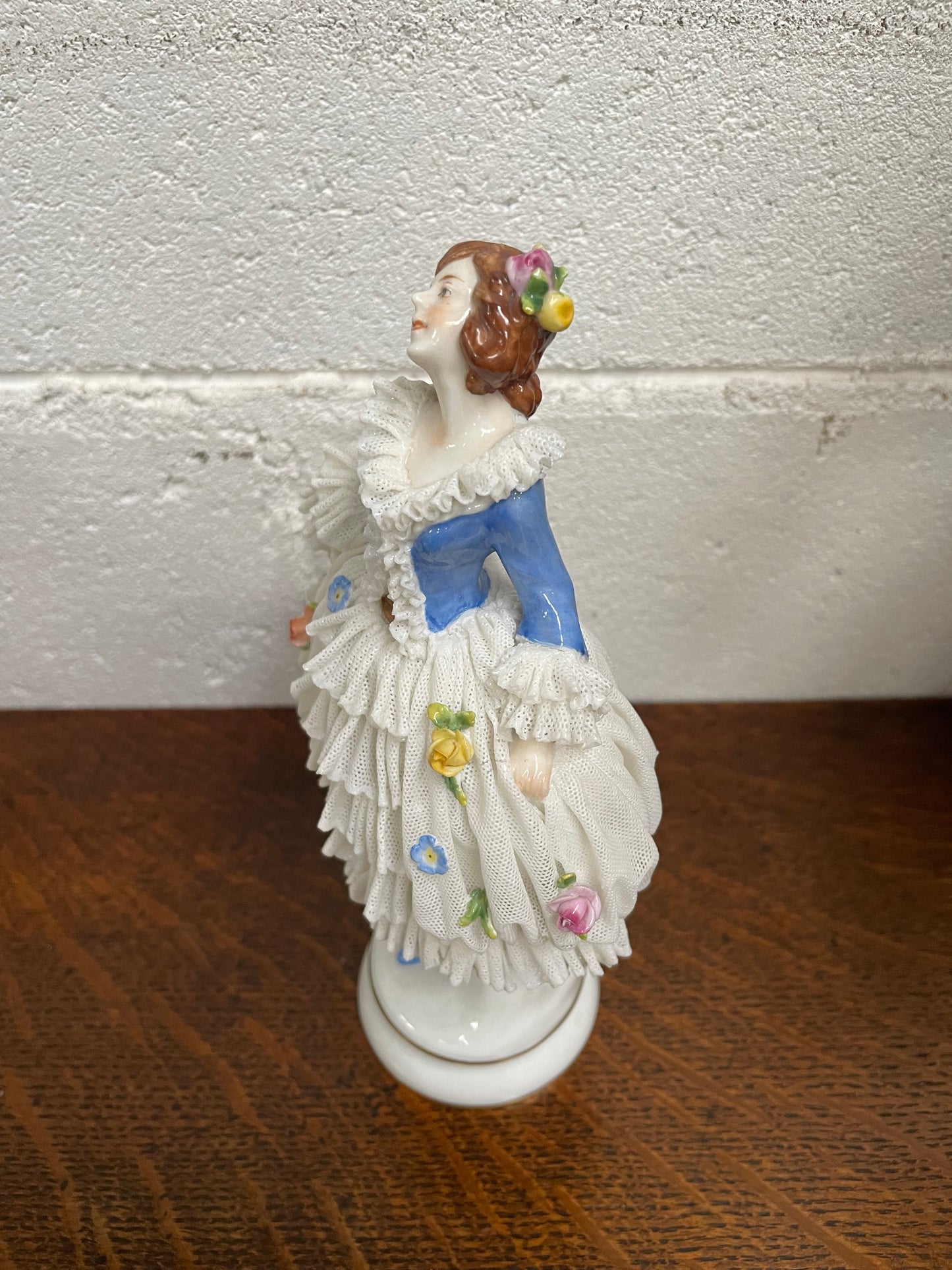 Dresden lace figurine stamped underneath and made in Germany. In good vintage condition with some slight damage to lace.