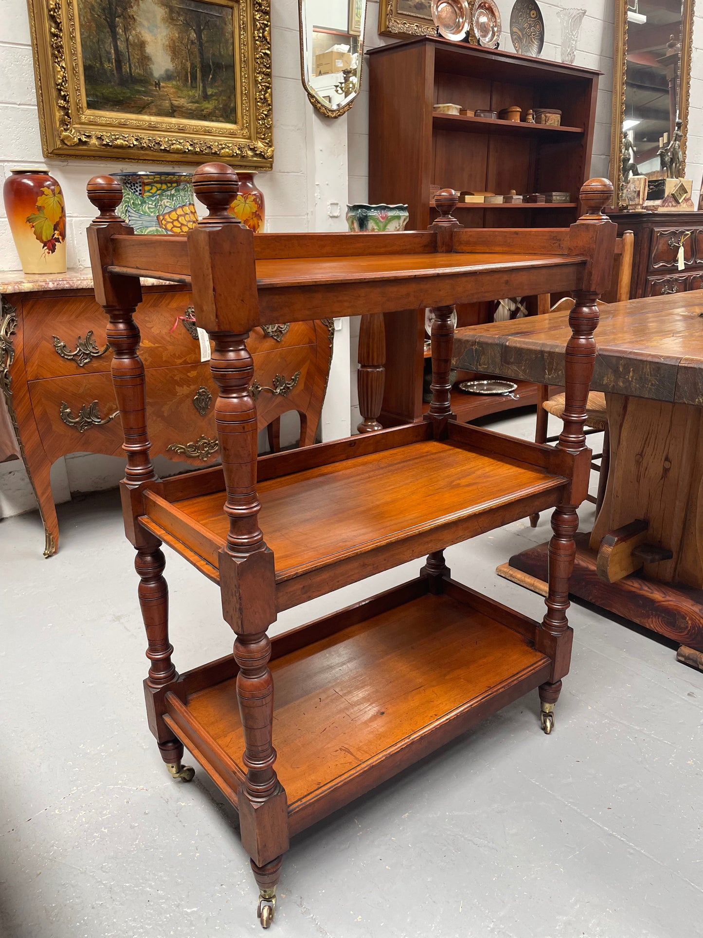 Three tier late Victorian Walnut dumb waiter. Sourced locally and circa 1890's. It is in good original detailed condition.