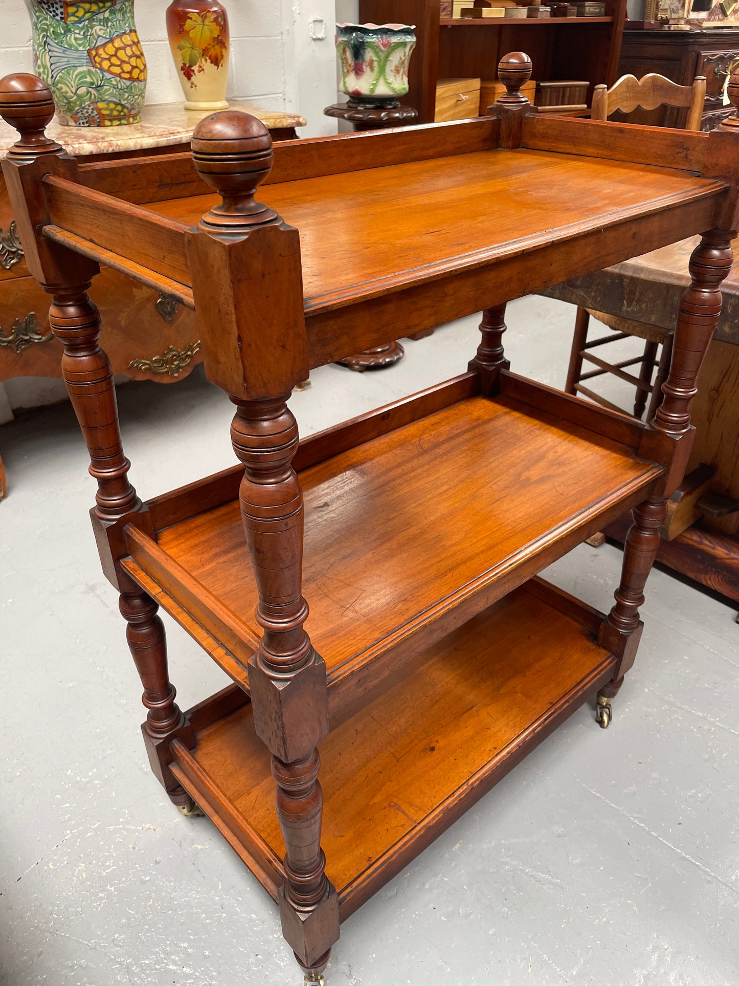 Three tier late Victorian Walnut dumb waiter. Sourced locally and circa 1890's. It is in good original detailed condition.