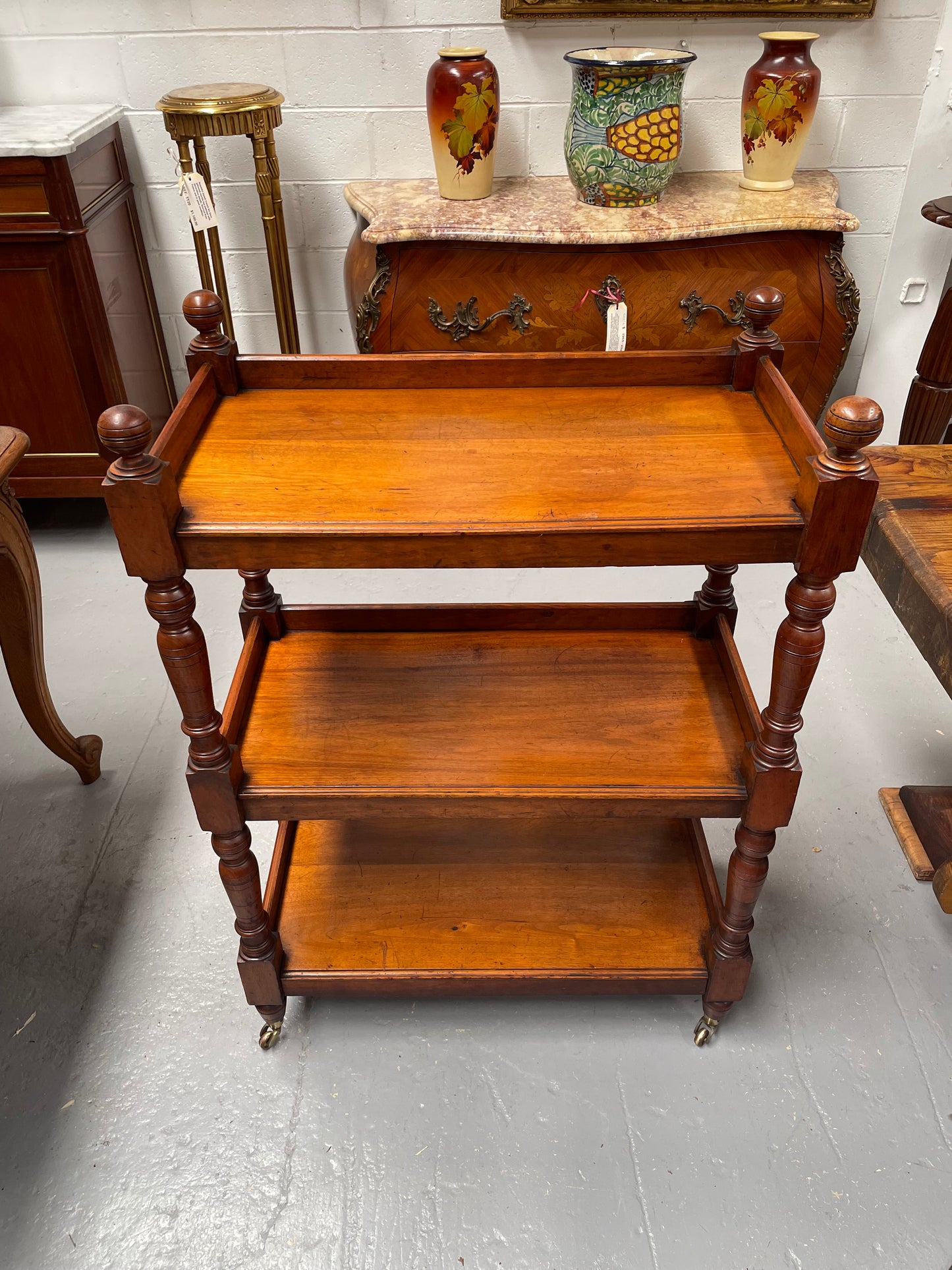 Three tier late Victorian Walnut dumb waiter. Sourced locally and circa 1890's. It is in good original detailed condition.