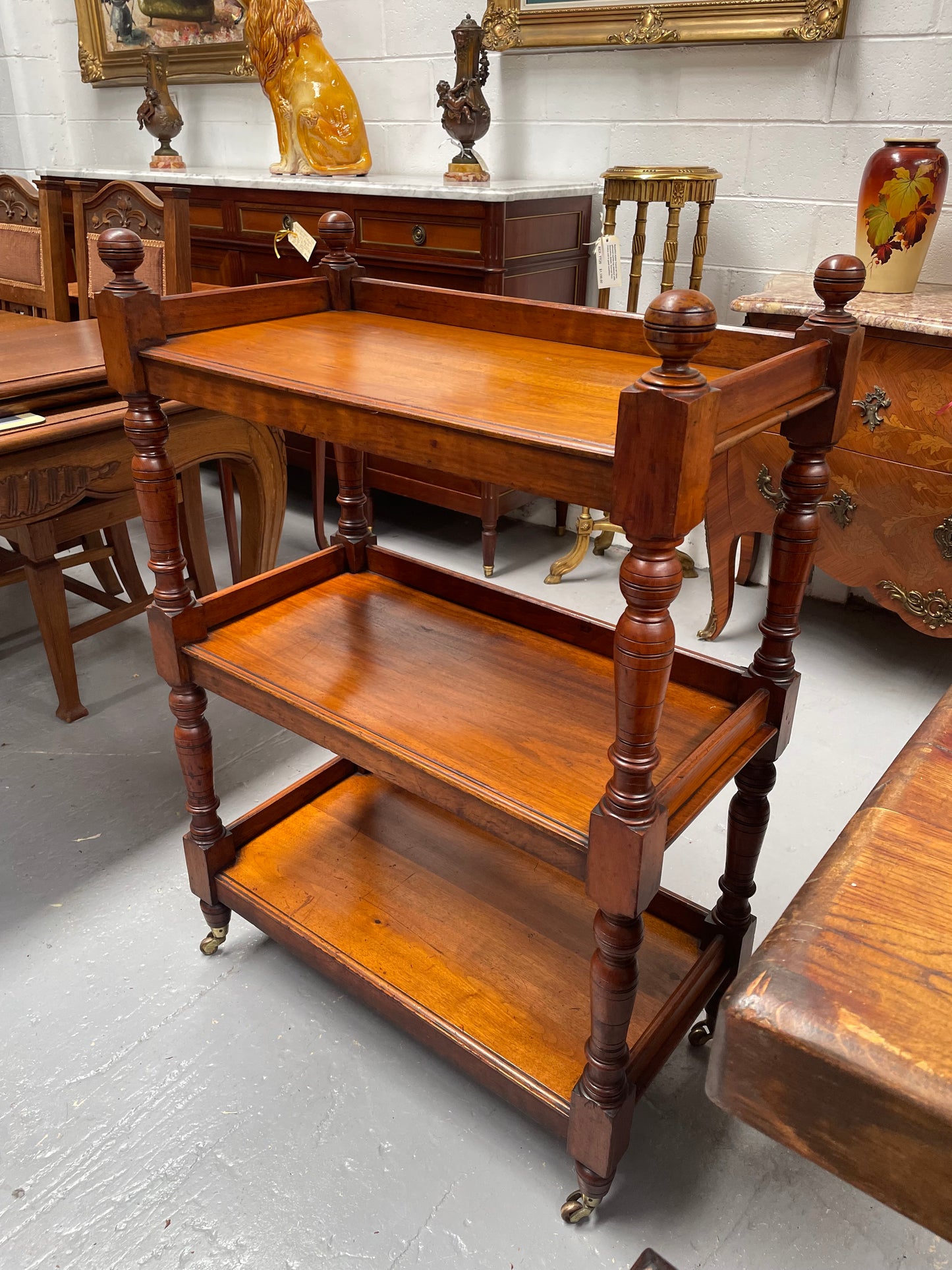 Three tier late Victorian Walnut dumb waiter. Sourced locally and circa 1890's. It is in good original detailed condition.