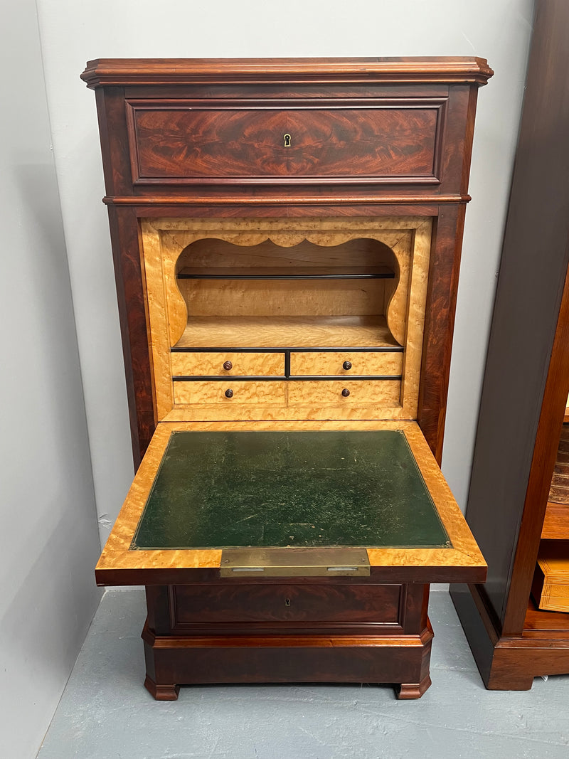 Early 19th Century Louis Phillipe style flame mahogany secretaire drawers. Presents as a seven drawer chest however three drawers are a drop down panel to a beautifully fitted secretaire/desk area. Sourced directly from France and in good original condition especially for its age.