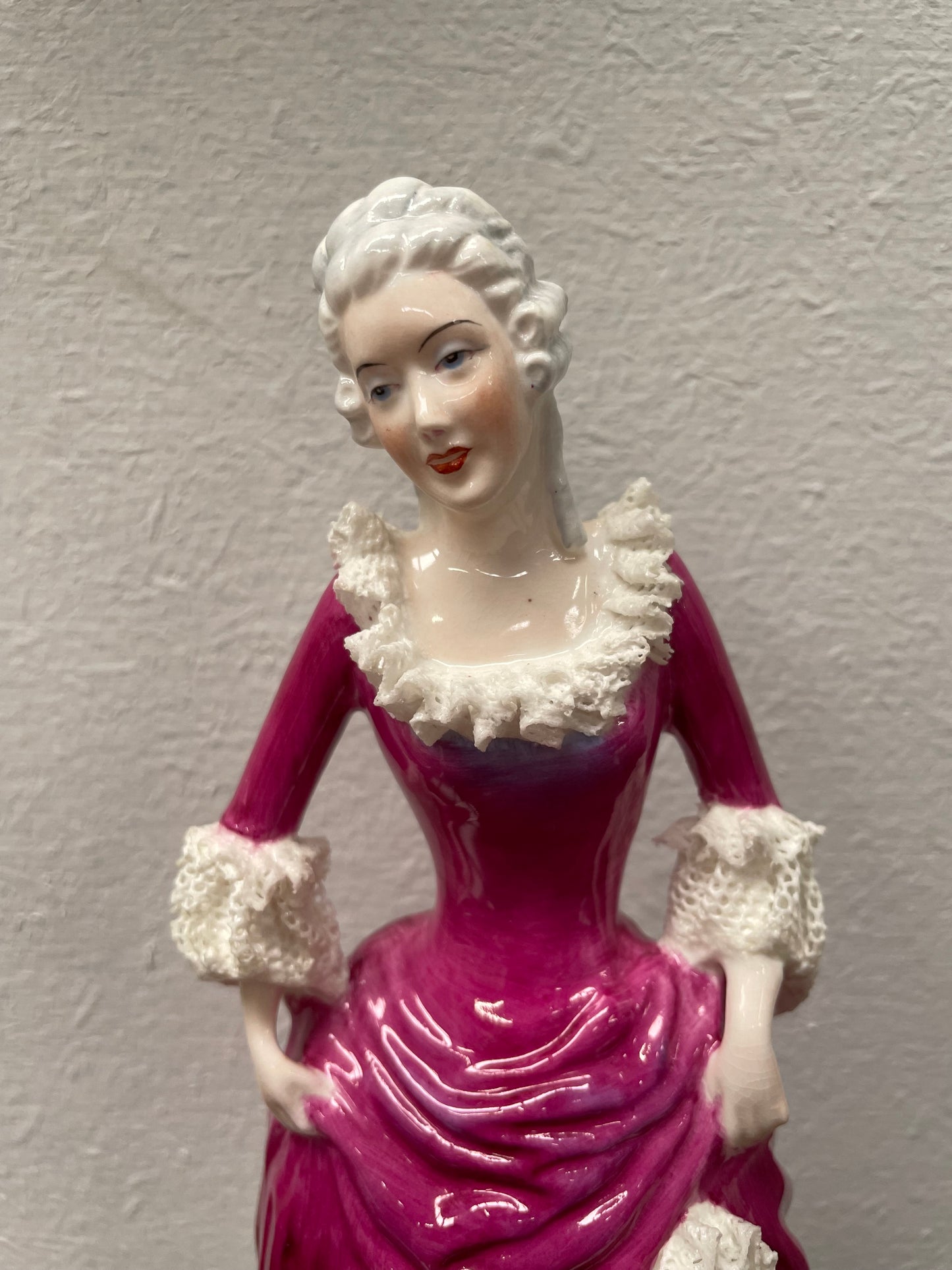 Beautiful English Staffordshire bone china lady figurine with lace. It is in good vintage condition. Please view photos as they help form part of the description.