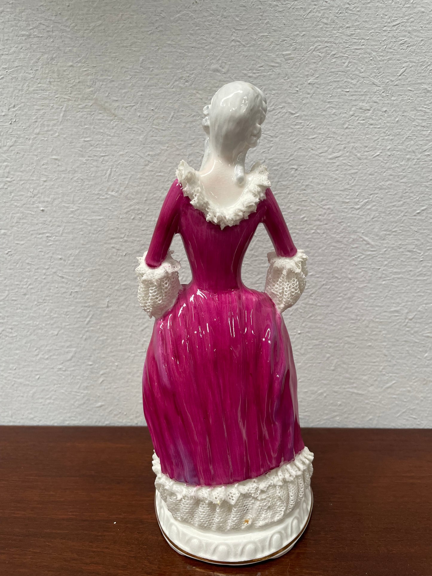Beautiful English Staffordshire bone china lady figurine with lace. It is in good vintage condition. Please view photos as they help form part of the description.