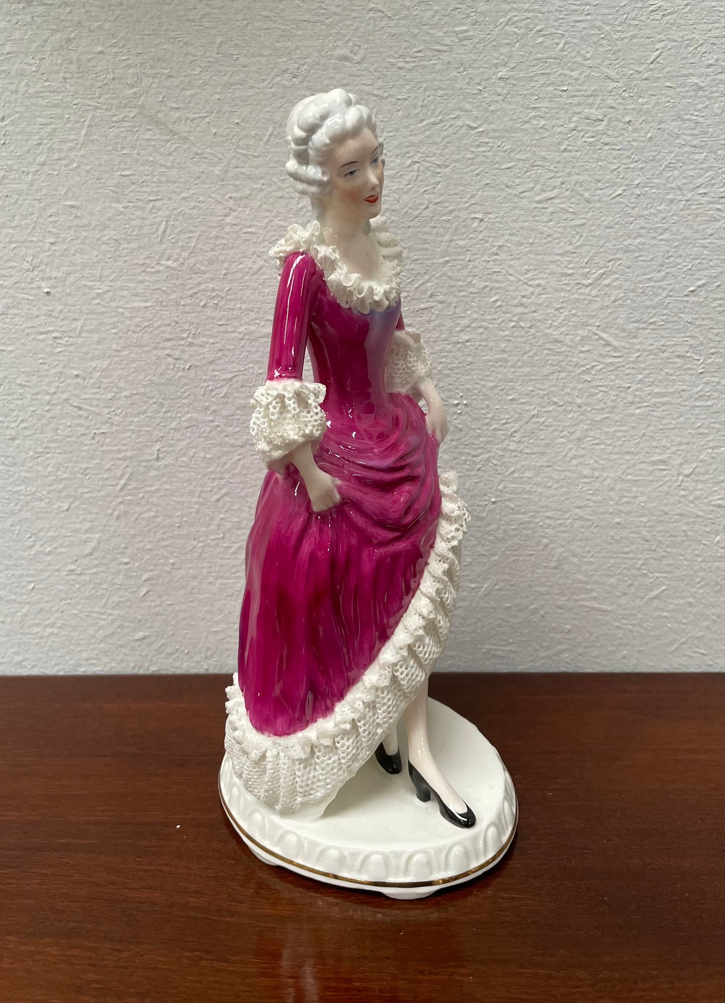 Beautiful English Staffordshire bone china lady figurine with lace. It is in good vintage condition. Please view photos as they help form part of the description.