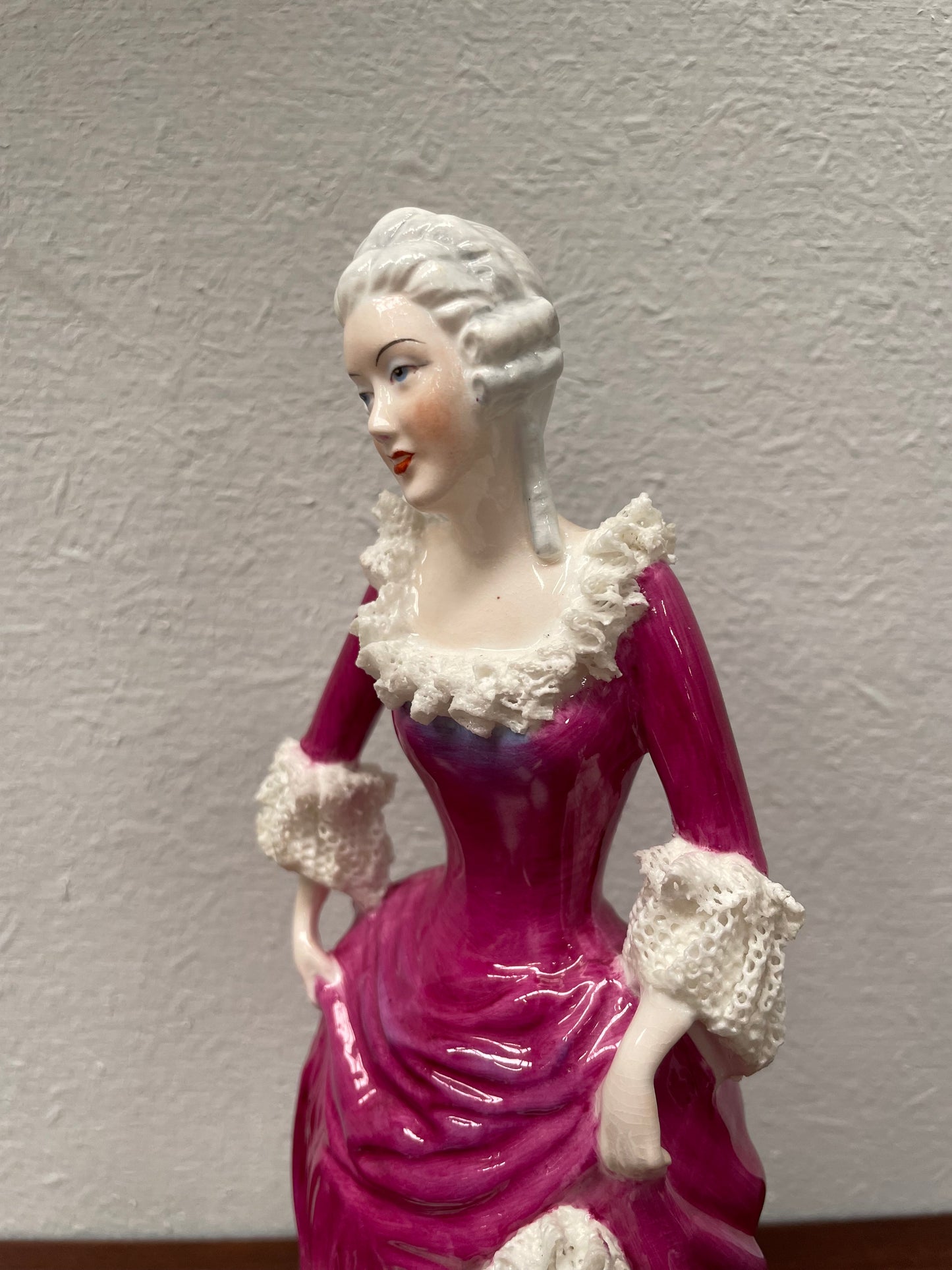 Beautiful English Staffordshire bone china lady figurine with lace. It is in good vintage condition. Please view photos as they help form part of the description.