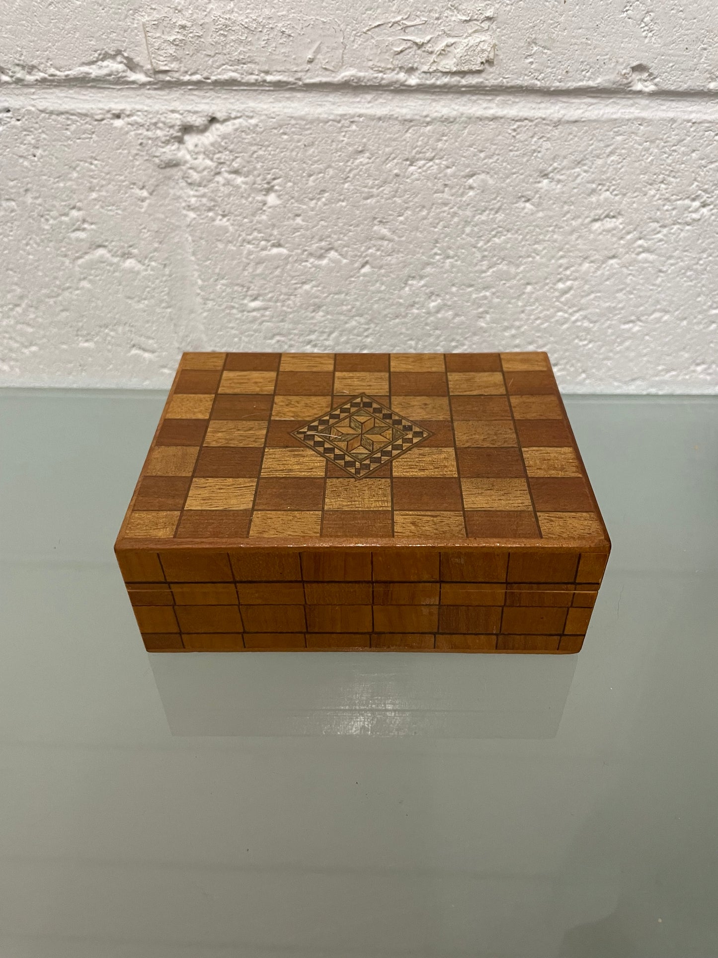 Beautiful Vintage inlaid wooden trinket box with a velvet base and mirror inside. It is in good original condition.