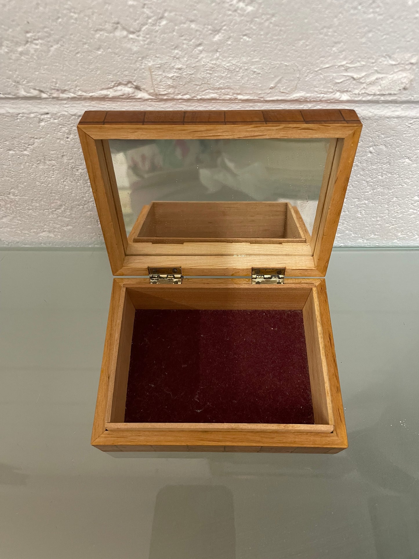 Beautiful Vintage inlaid wooden trinket box with a velvet base and mirror inside. It is in good original condition.