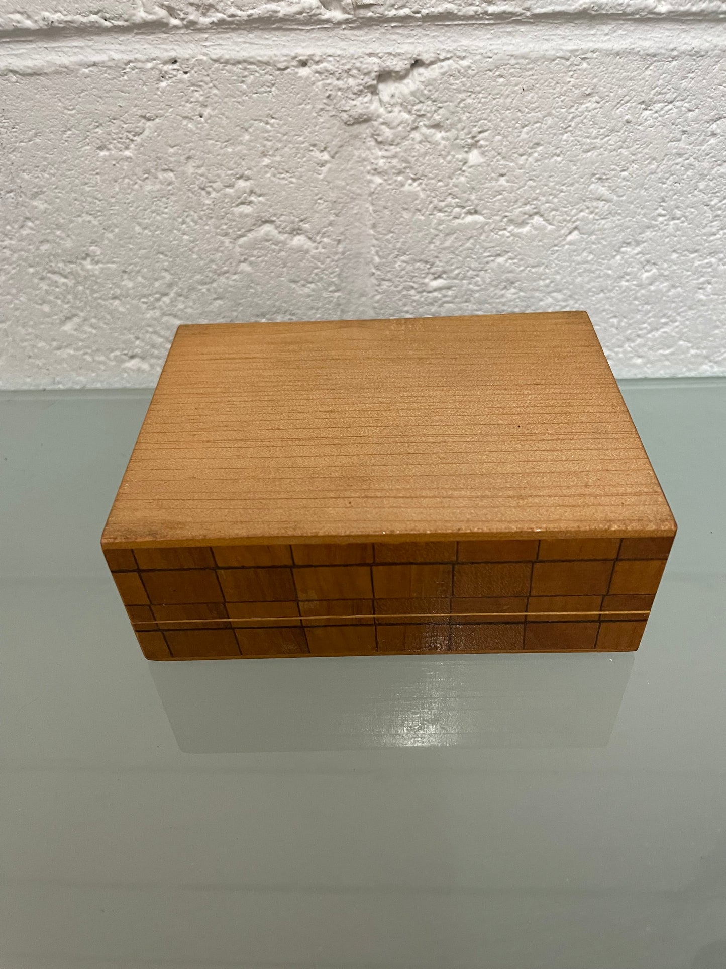 Beautiful Vintage inlaid wooden trinket box with a velvet base and mirror inside. It is in good original condition.