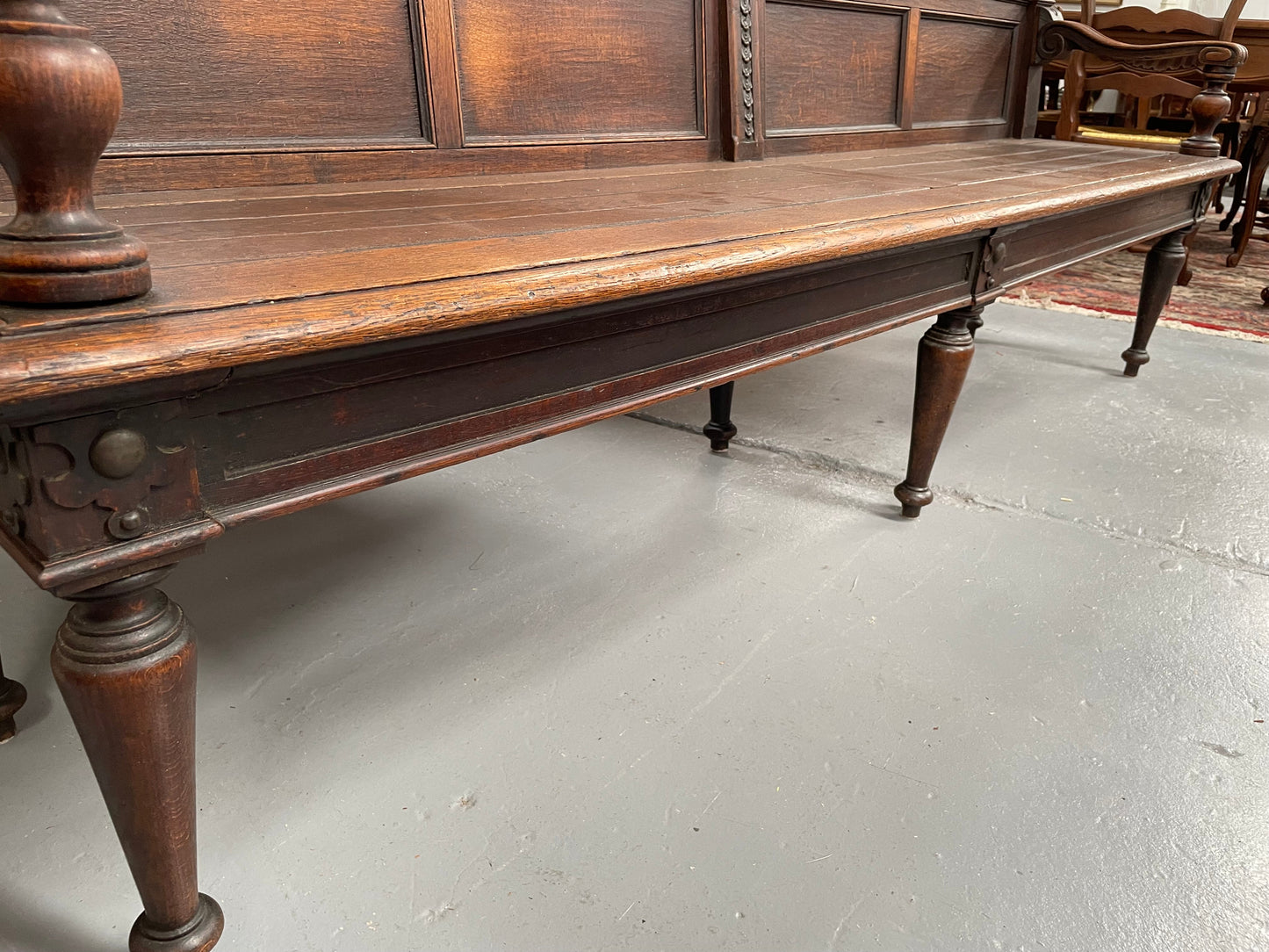 Hard to find 19th Century French Oak bench seat with decorative carvings and brass embossed metal work. It has been sourced from France and is in good original detailed condition.