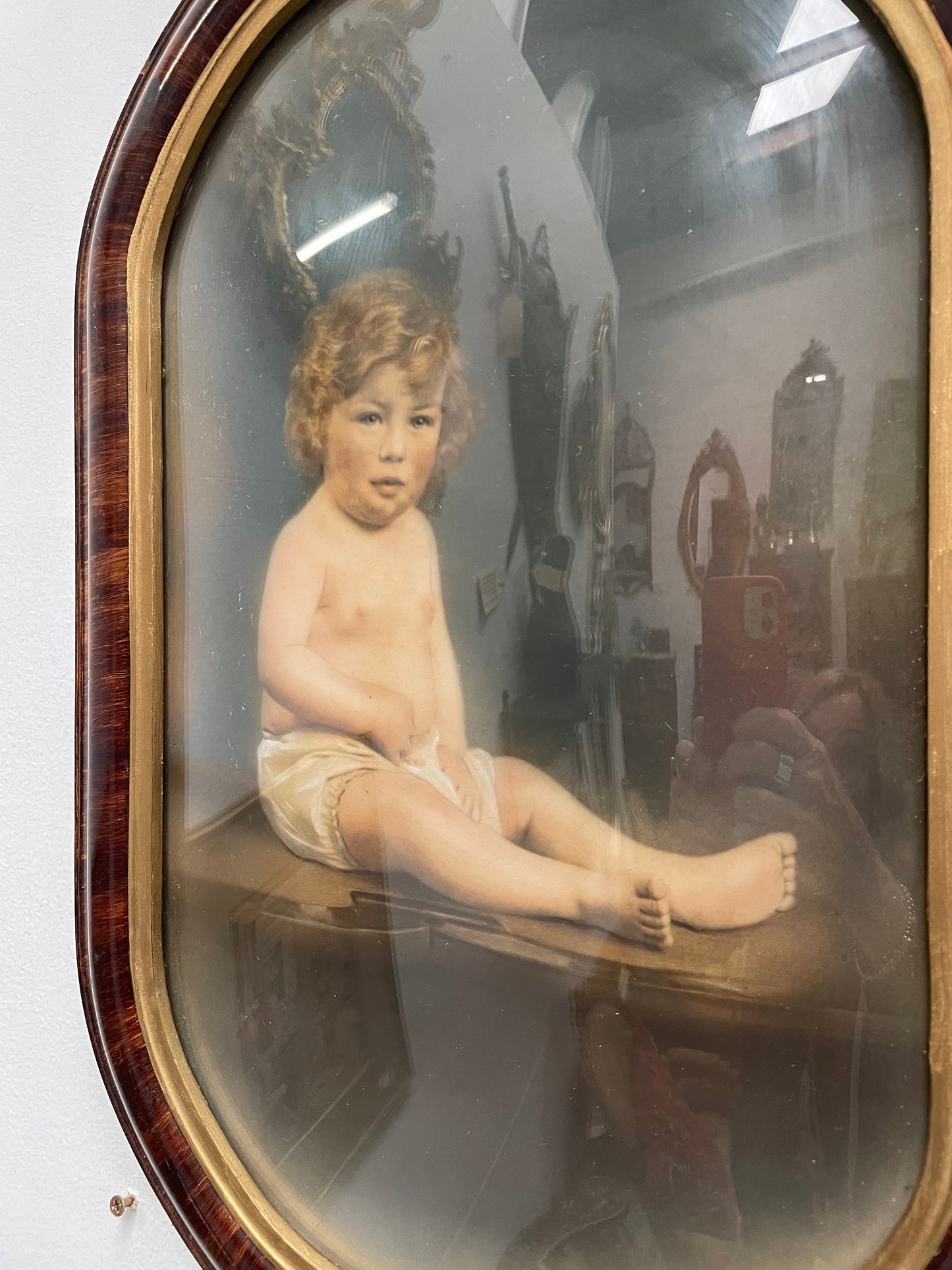 Lovely Art Deco photo frame with concave glass and a beautiful photo of a young child . Ready to hang. Sourced locally and in good original condition.