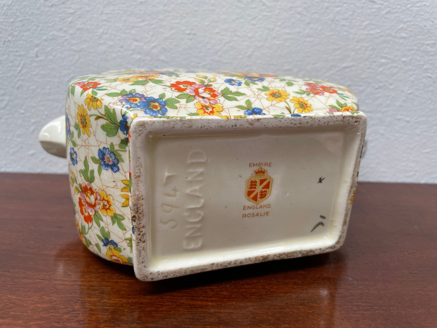 Empire made in England teapot With floral pattern. Marked underneath and is in good original used condition with no chips. Please view photos as they help form part of the description.
