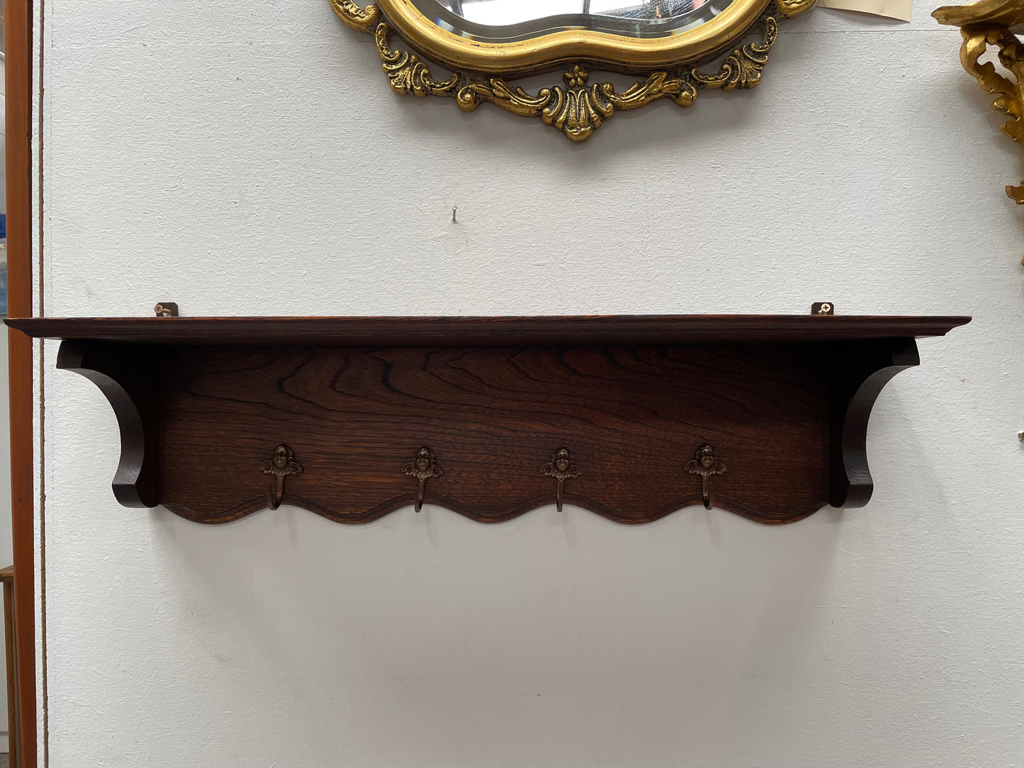 Charming French oak four Cherub shaped hook coat rack with shelf. Sourced from France and is in good original condition.