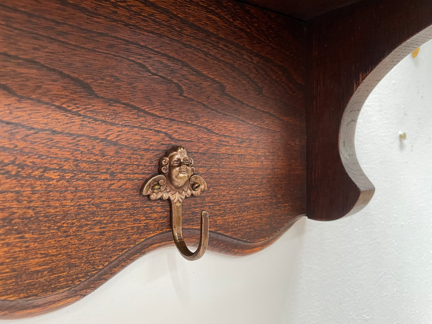 Charming French oak four Cherub shaped hook coat rack with shelf. Sourced from France and is in good original condition.