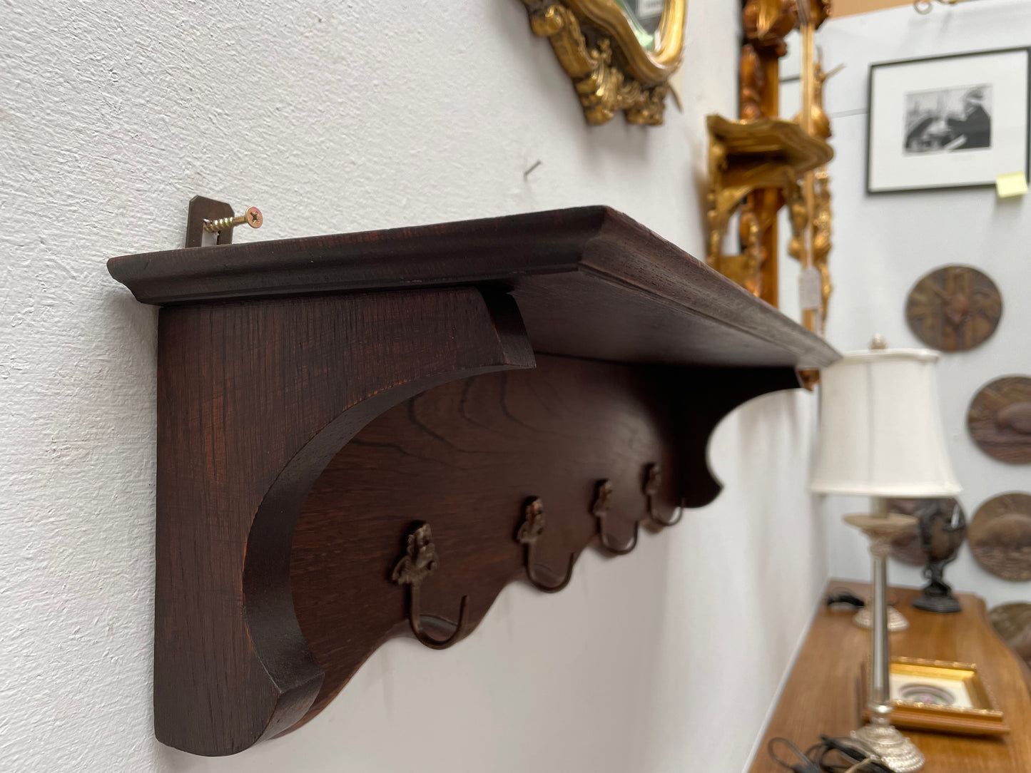 Charming French oak four Cherub shaped hook coat rack with shelf. Sourced from France and is in good original condition.