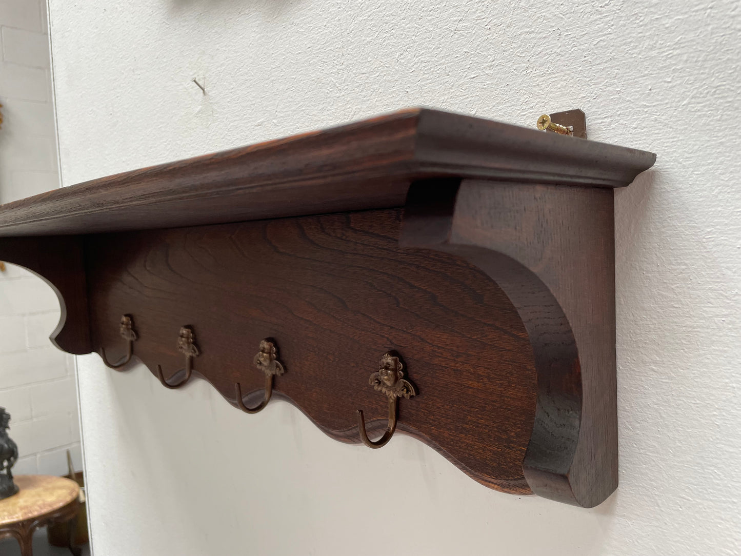 Charming French oak four Cherub shaped hook coat rack with shelf. Sourced from France and is in good original condition.