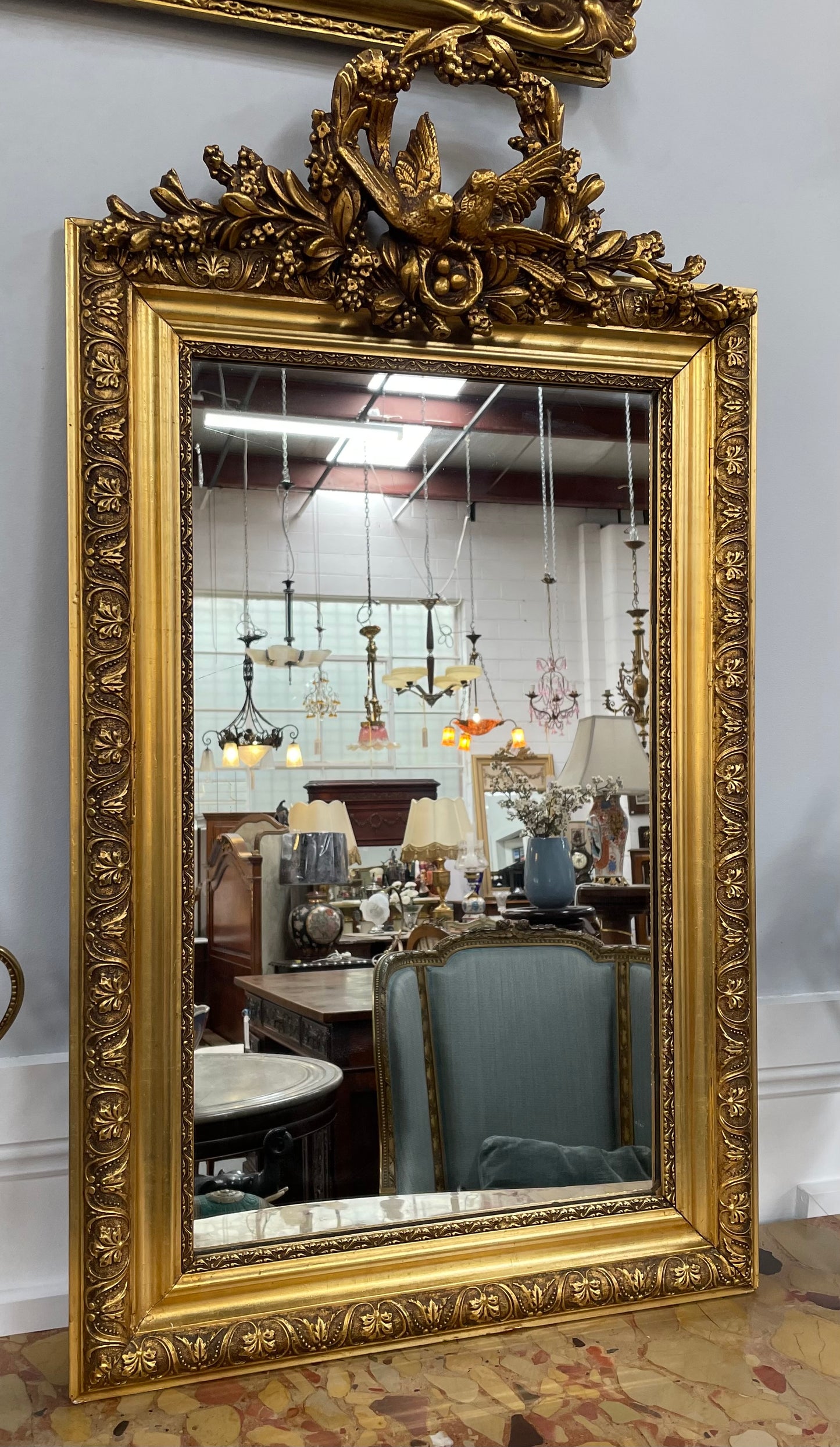 Compact Late 19th Century French Gilt Framed Wall Mirror Featuring Carved Birds