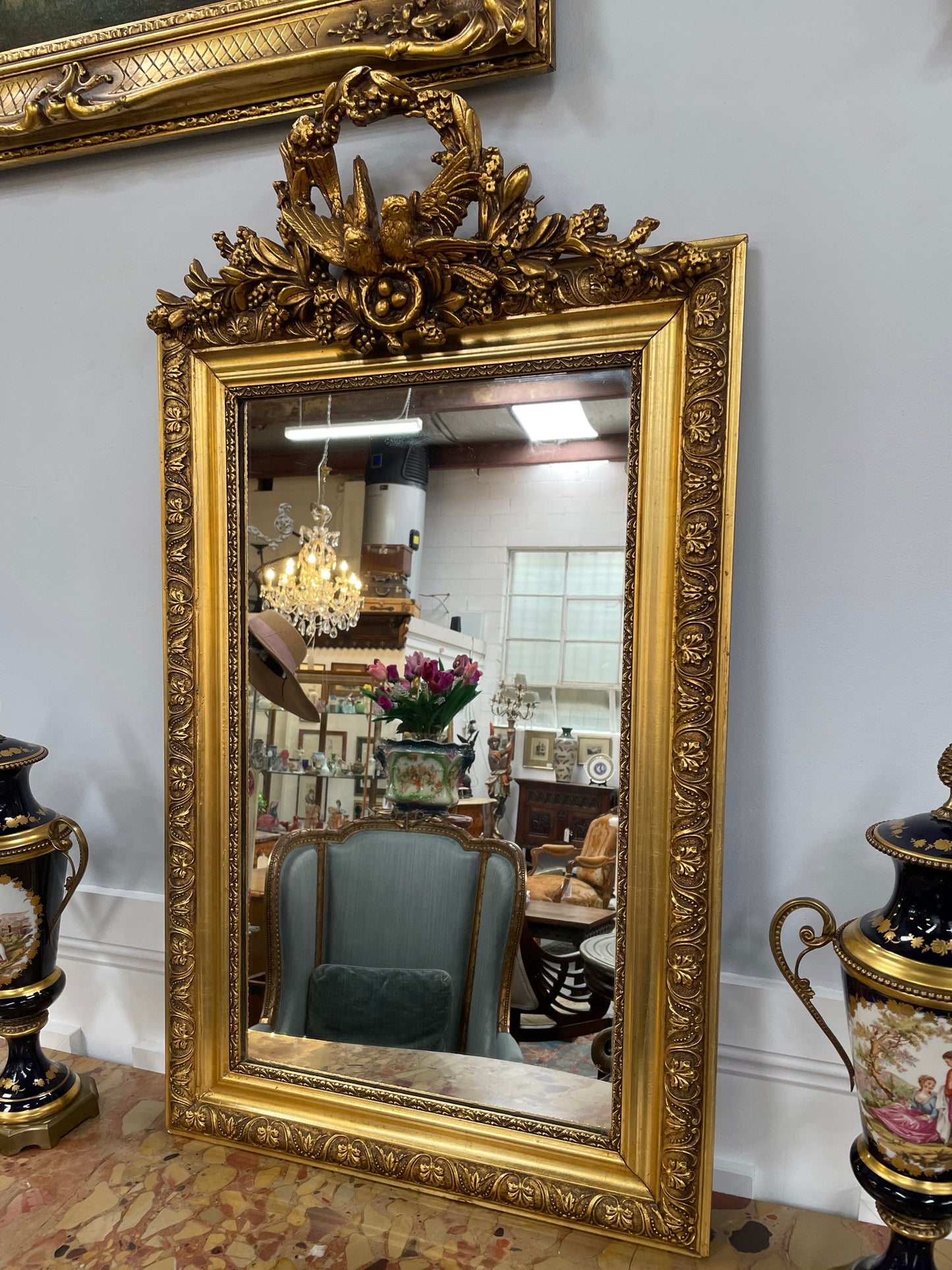Compact Late 19th Century French Gilt Framed Wall Mirror Featuring Carved Birds
