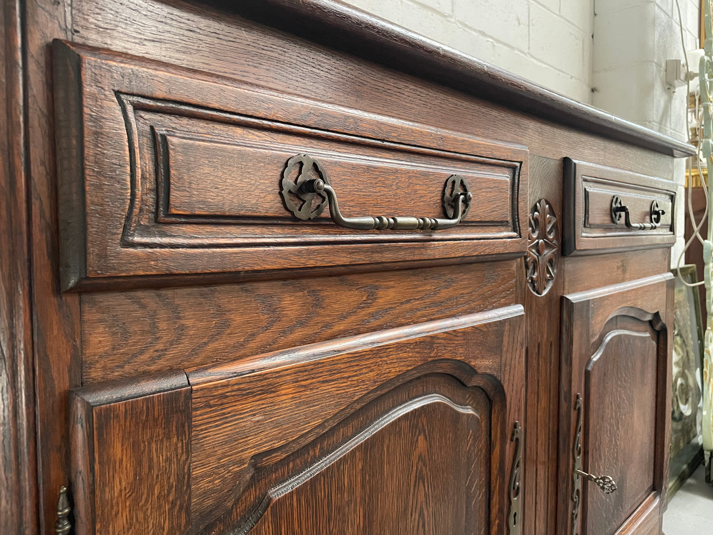 Charming French Oak provincial two door buffet. It has two drawers and a cupboard with two doors and one shelf. It is in good original condition and has been sourced directly from France.