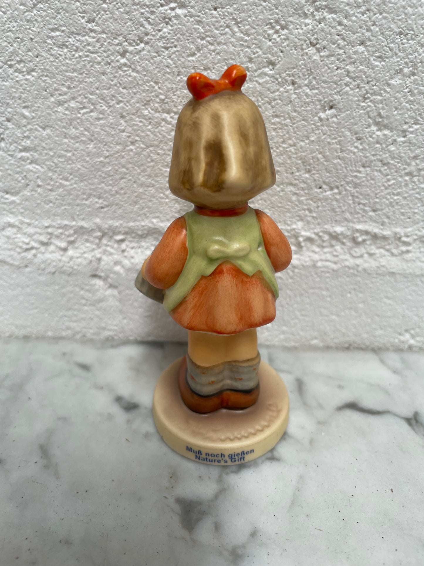 Beautiful Goebel Hummel figurine "Natures Gift" dated 1996, of a girl with her watering can. In good original condition, please see photos as they form part of the description.
