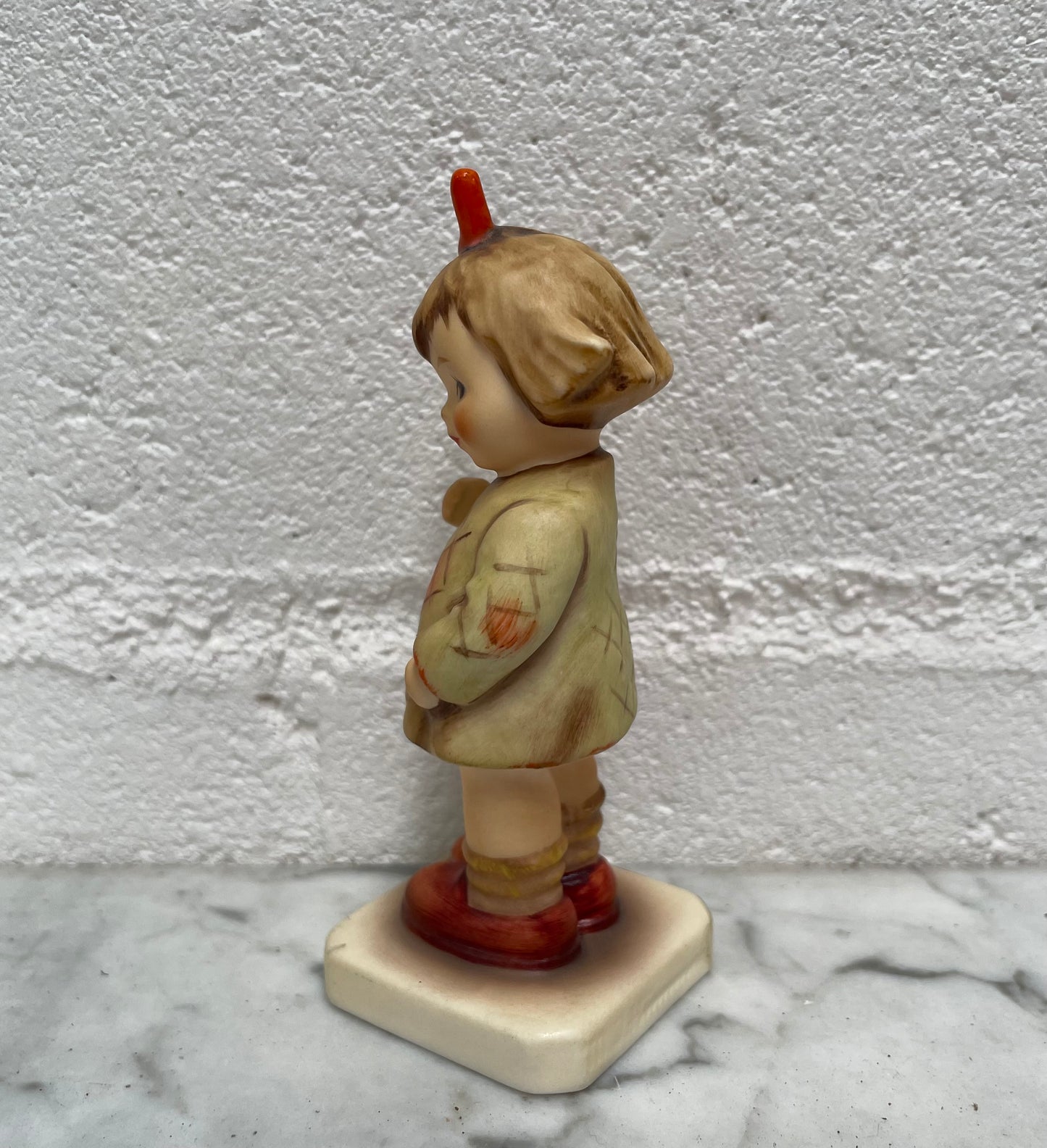 Beautiful Hummel Figurine "I Bought You a Gift", of a girl with her basket. In good original condition. Please see photos as they form part of the description.