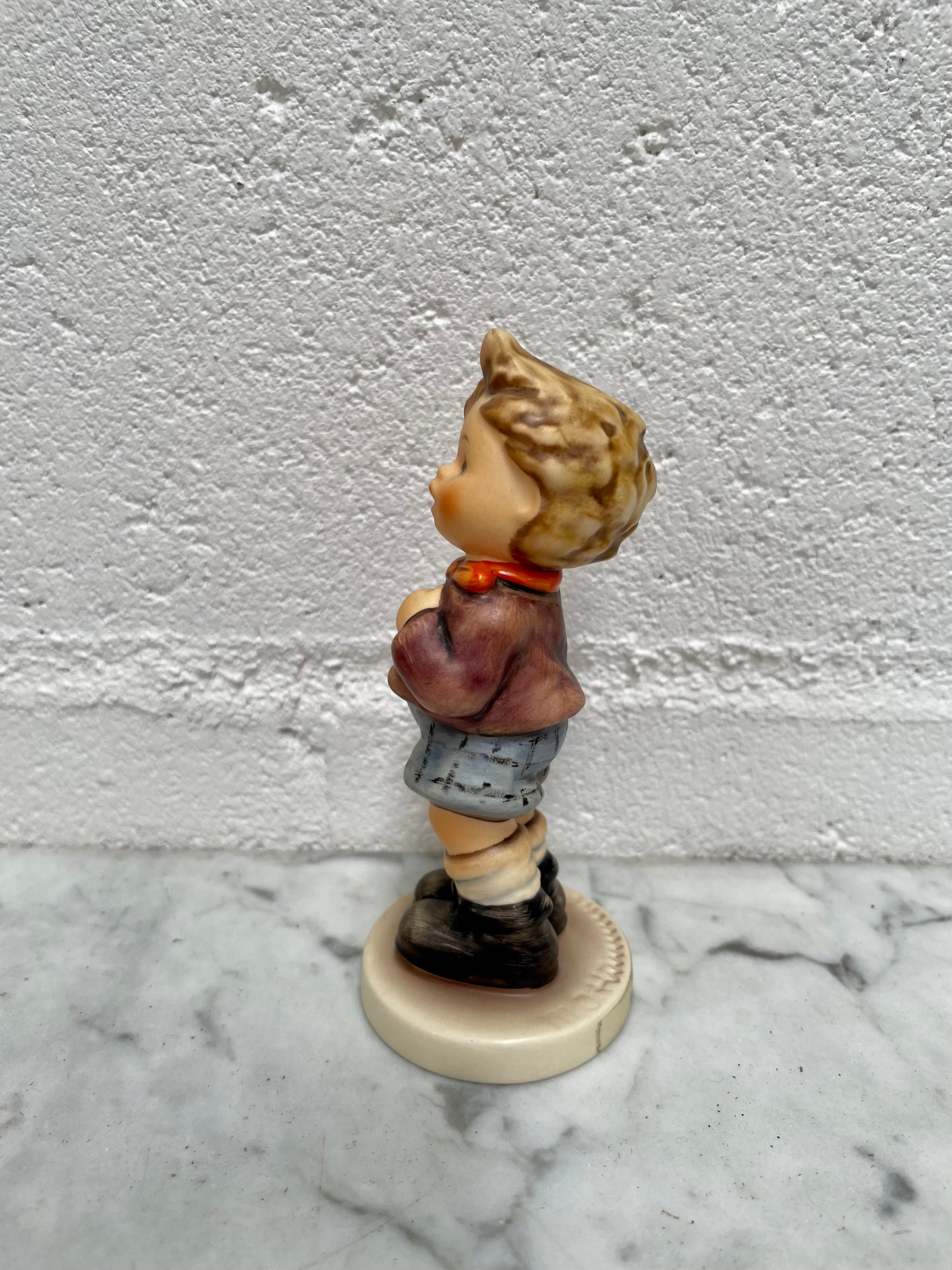 Sweet Vintage Hummel figurine "Cheeky Fellow" 1992 of a boy with his apple. It is in good original condition. Please see photos as they form part of the description.