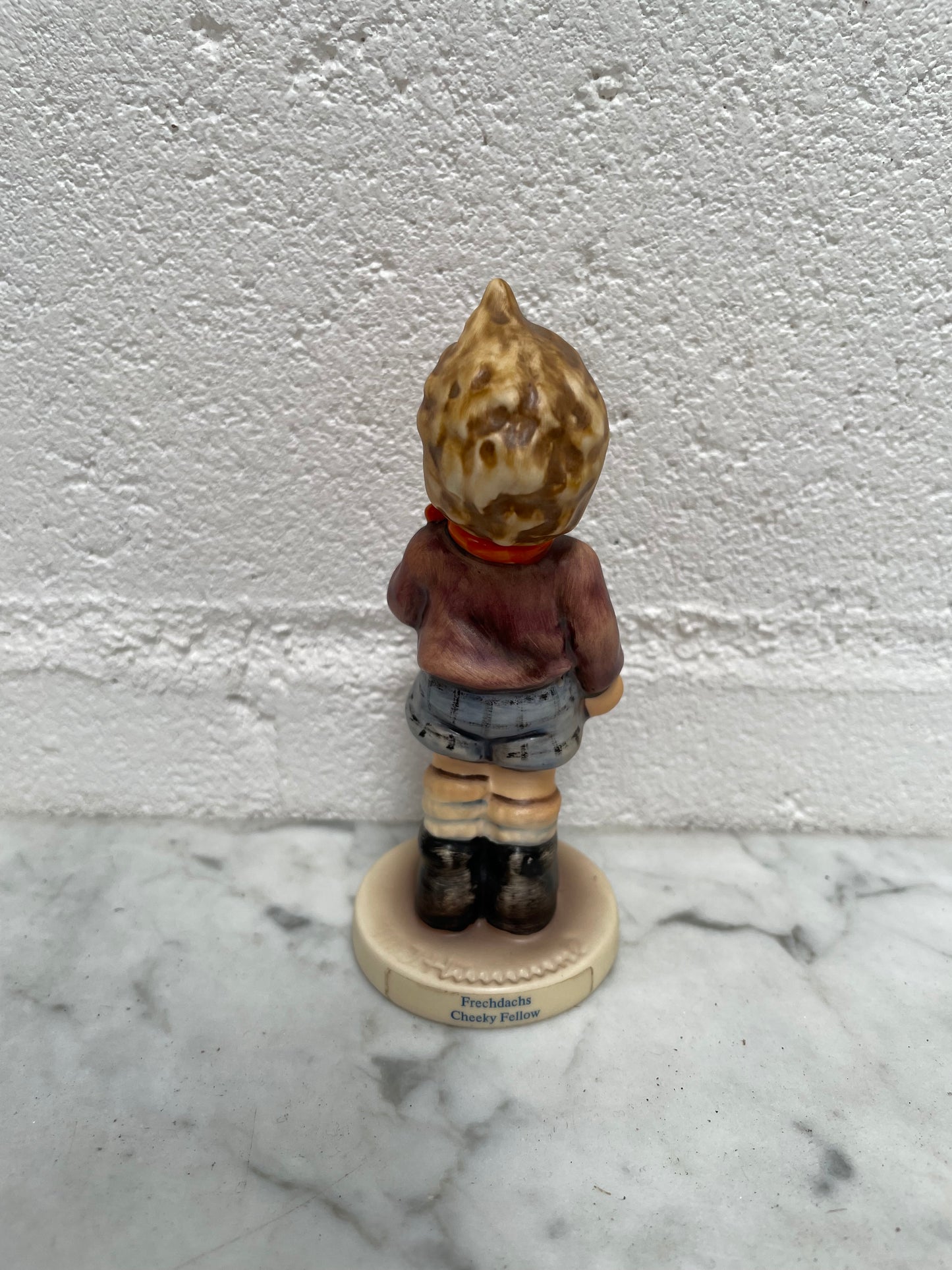 Sweet Vintage Hummel figurine "Cheeky Fellow" 1992 of a boy with his apple. It is in good original condition. Please see photos as they form part of the description.