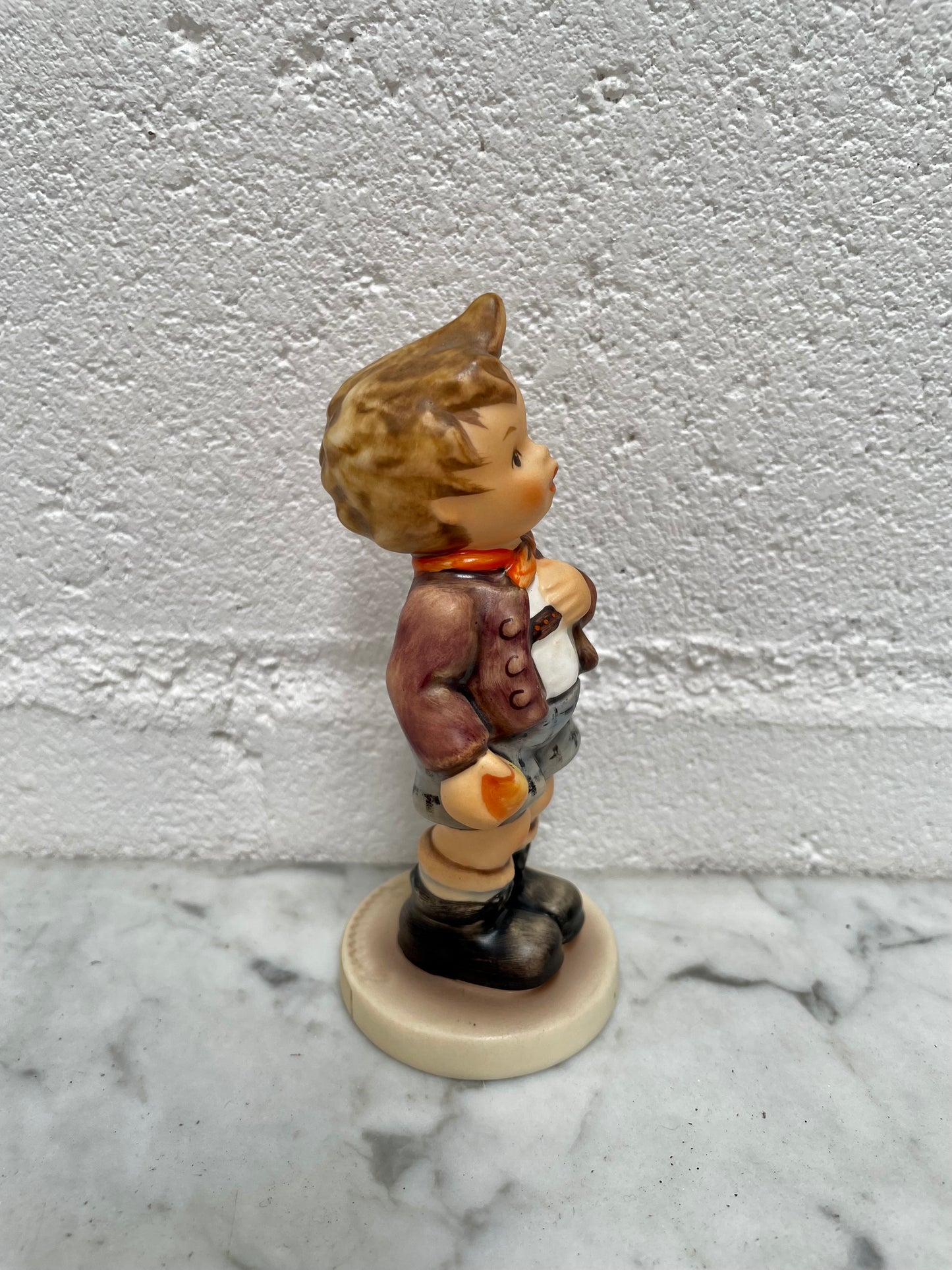 Sweet Vintage Hummel figurine "Cheeky Fellow" 1992 of a boy with his apple. It is in good original condition. Please see photos as they form part of the description.