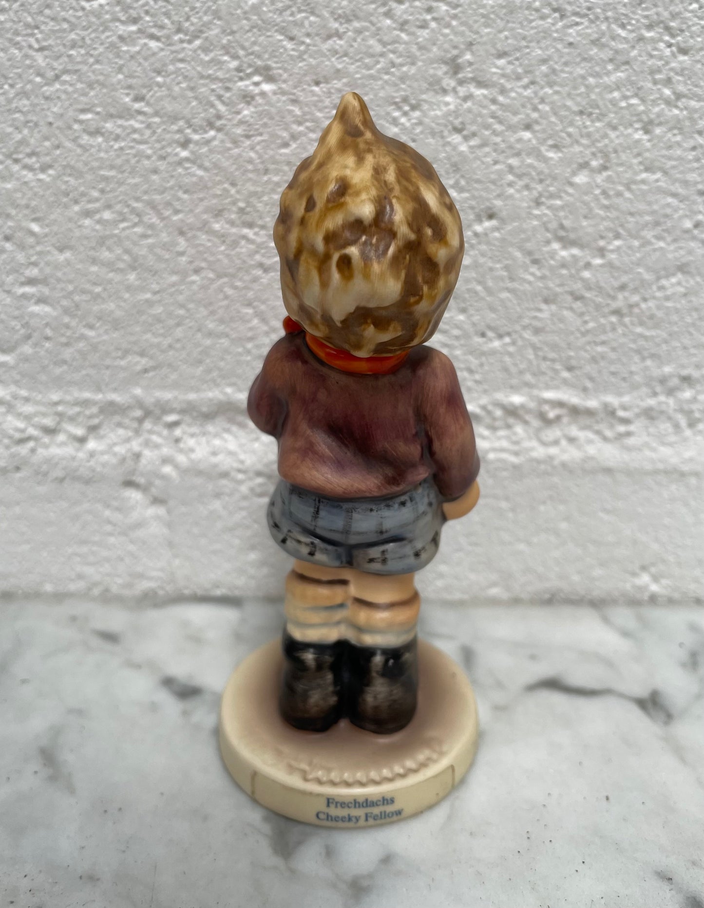 Sweet Vintage Hummel figurine "Cheeky Fellow" 1992 of a boy with his apple. It is in good original condition. Please see photos as they form part of the description.