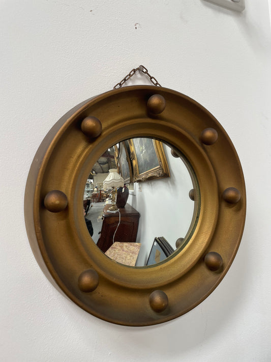 An elegant compact round convex wall mirror with lovely details that has been sourced directly from France. It is in good original condition. Please see photos as they form part of the description and condition.