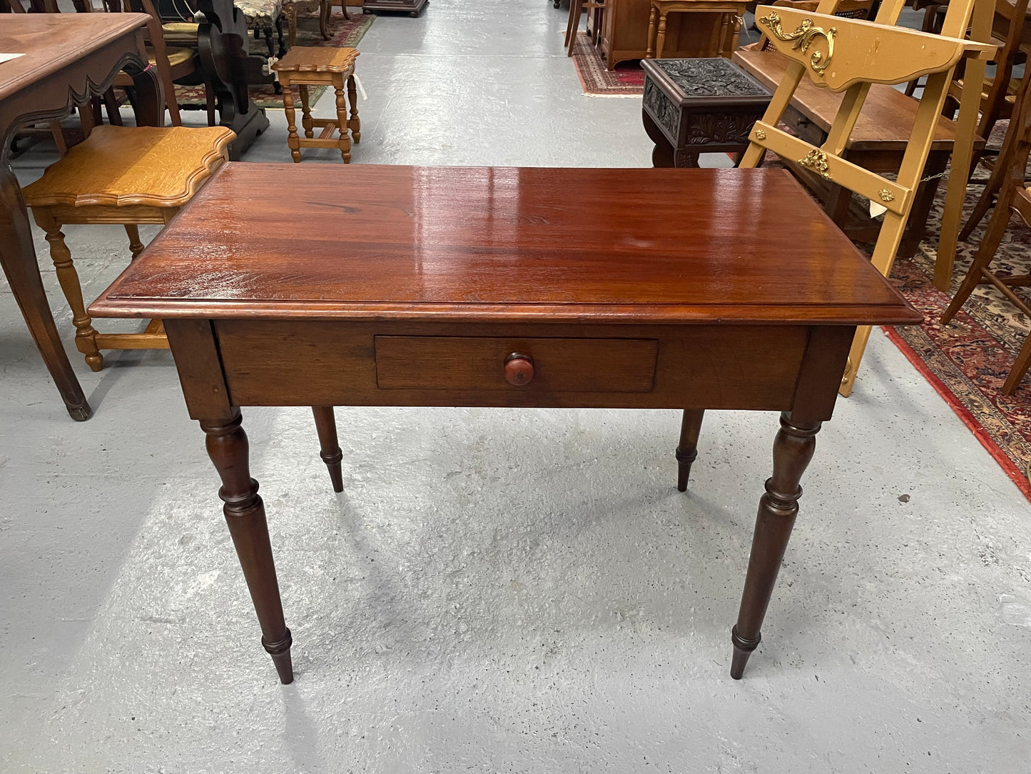 This beautiful Victorian Cedar table would be ideal as a console/side table or as a small desk. It features beautiful turned legs and a drawer for storage. Sourced locally it is in good original detailed condition.