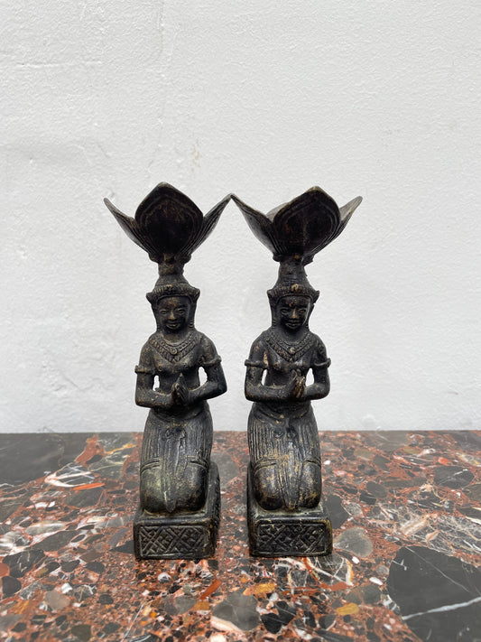 Pair of Thai Antique bronze dark patinated candle holders. They are in good original condition with some signs of age.