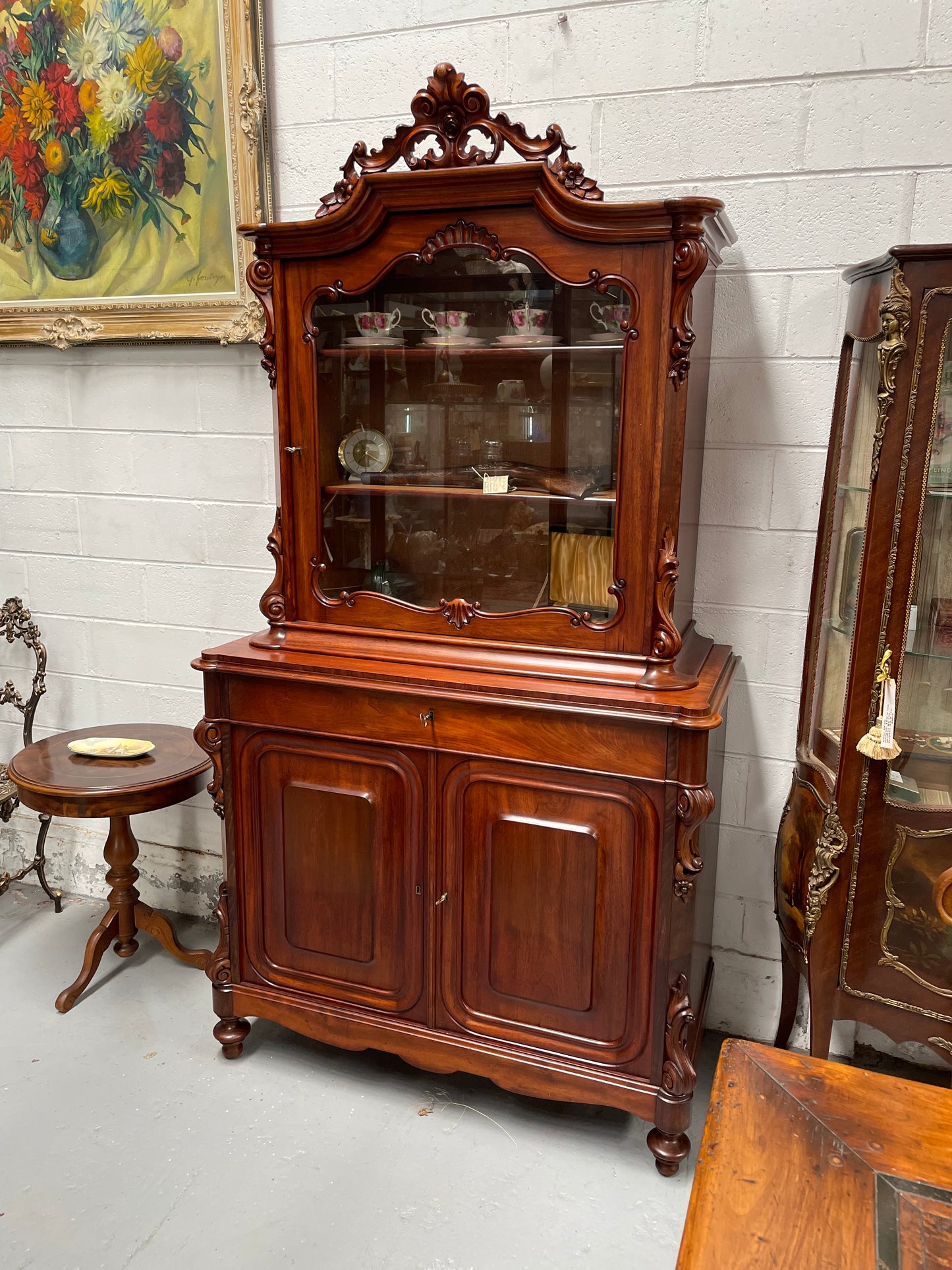 Outstanding French Mahogany sideboard of good small proportions. It has a lovely display area at the top and hidden storage at the bottom. In good restored condition. Circa 1860.