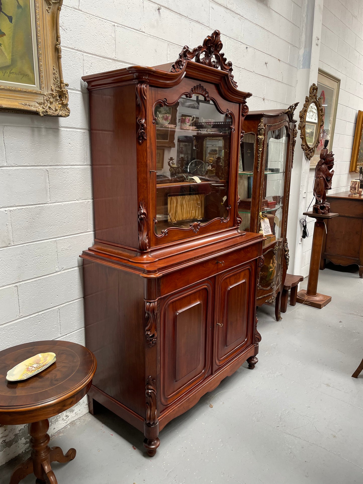 Outstanding French Mahogany sideboard of good small proportions. It has a lovely display area at the top and hidden storage at the bottom. In good restored condition. Circa 1860.