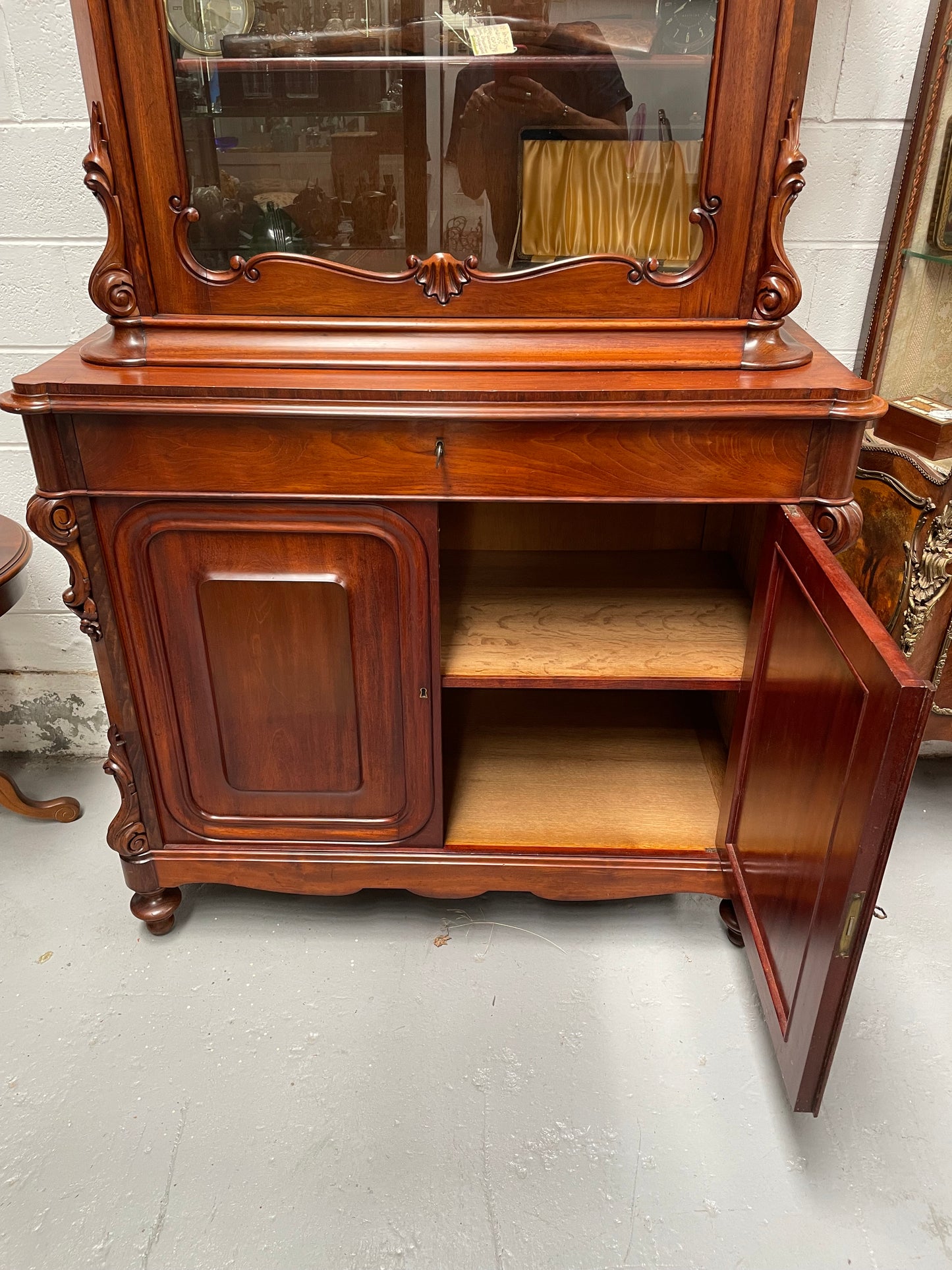 Outstanding French Mahogany sideboard of good small proportions. It has a lovely display area at the top and hidden storage at the bottom. In good restored condition. Circa 1860.