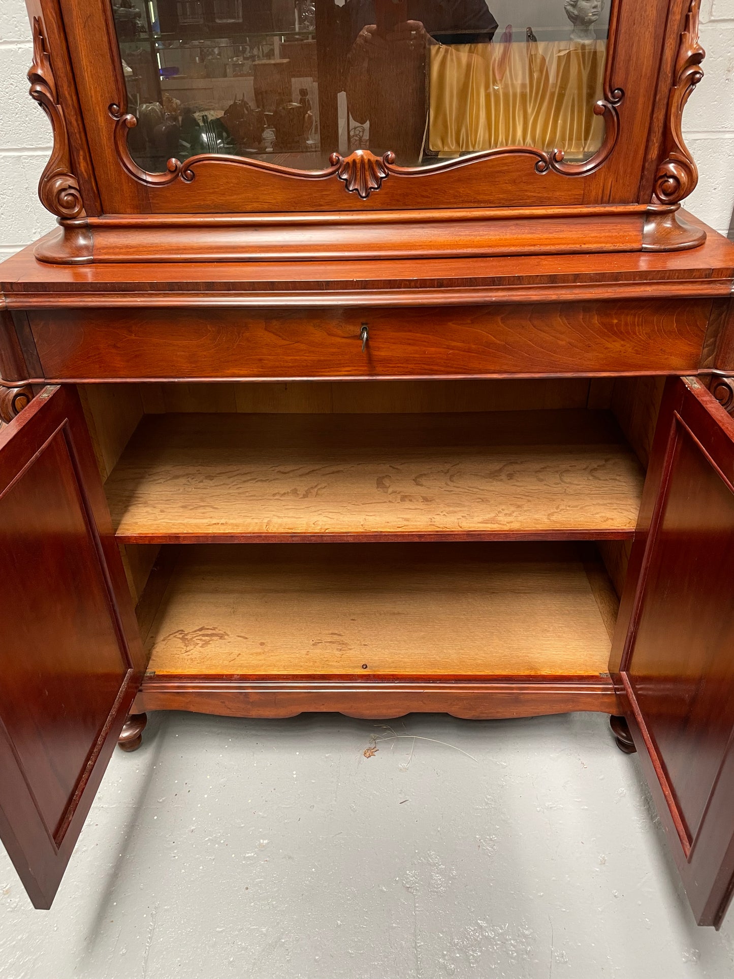 Outstanding French Mahogany sideboard of good small proportions. It has a lovely display area at the top and hidden storage at the bottom. In good restored condition. Circa 1860.